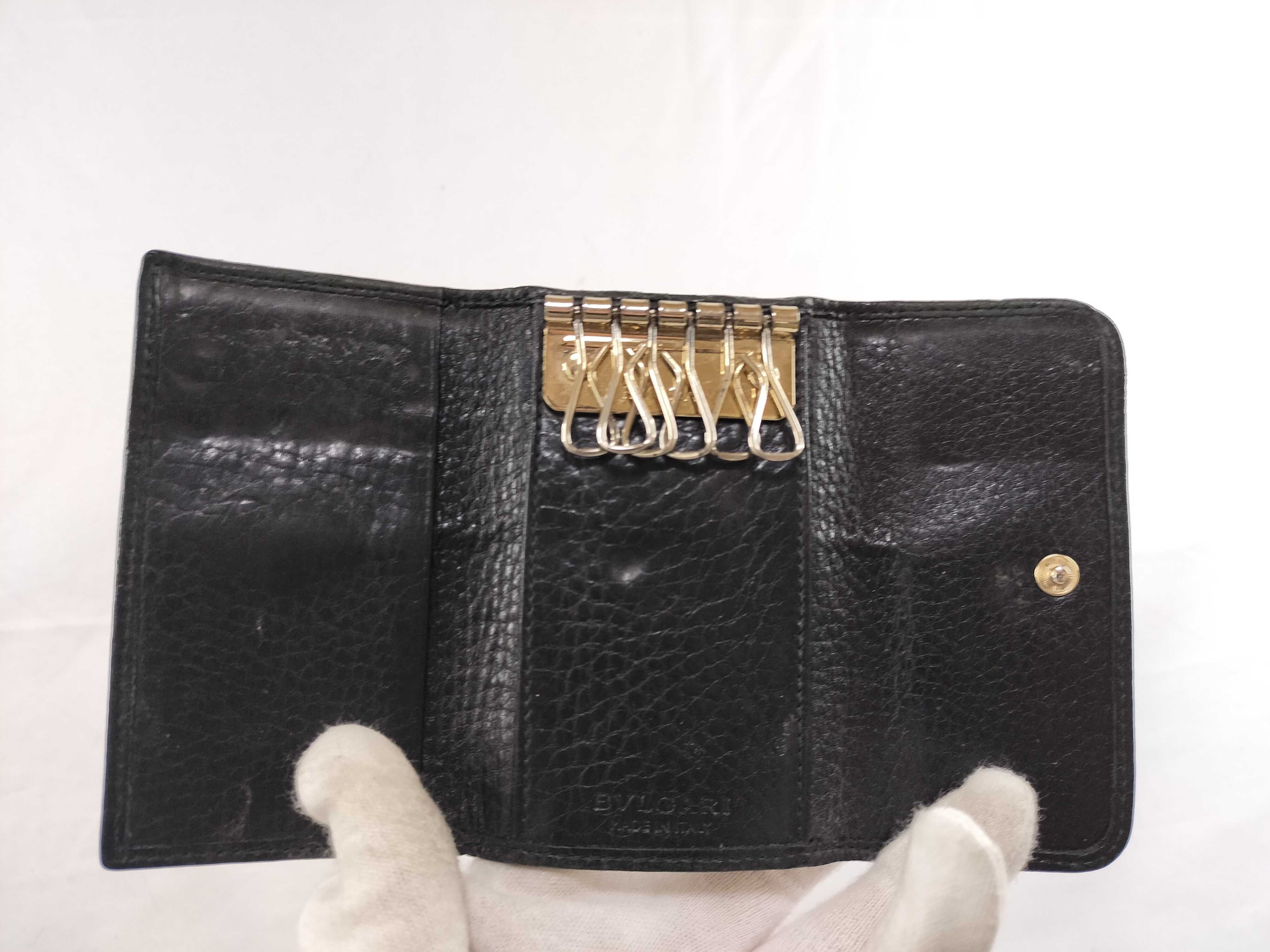 A Collection of Five Designer Leather Key Cases - Cartier, Bvlgari, Bottega Veneta, and Lanvin