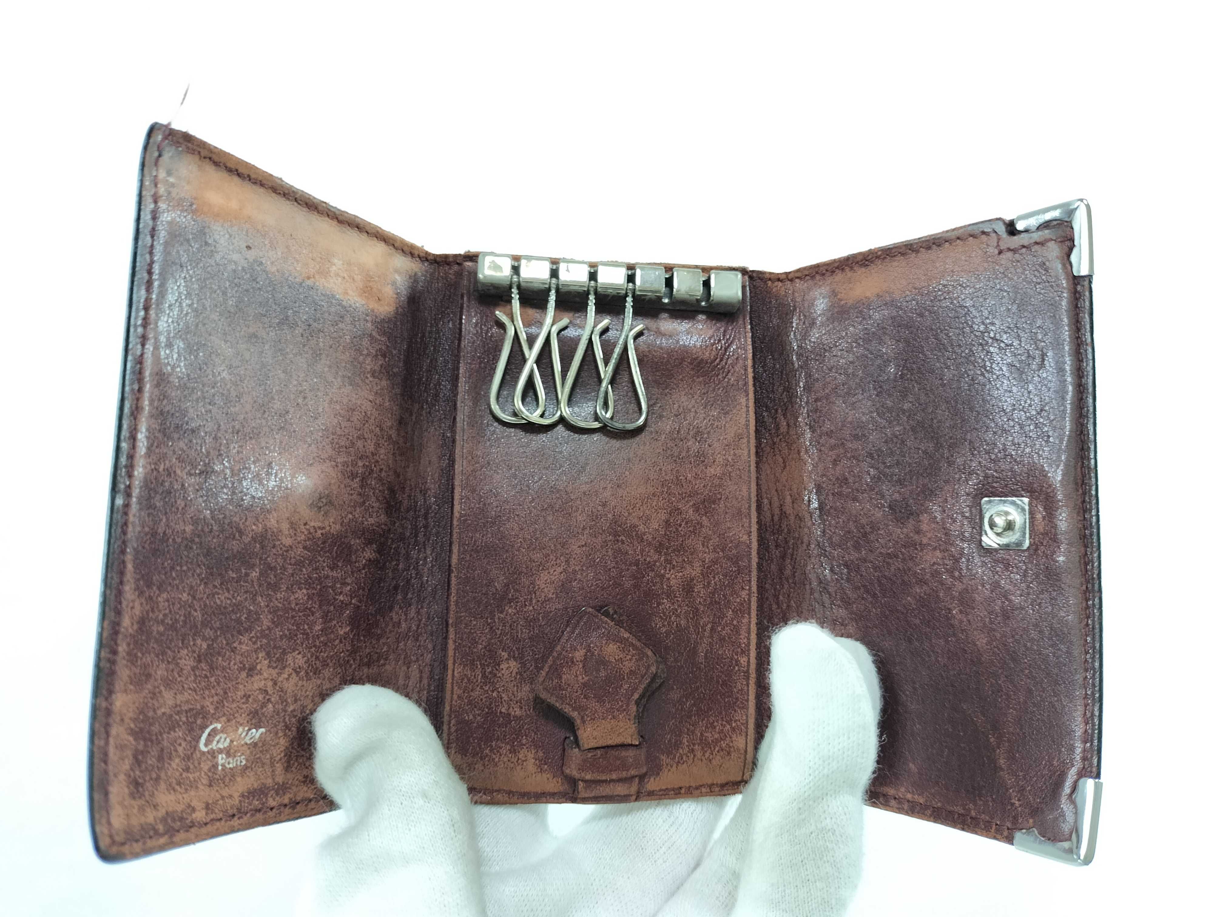 A Collection of Five Designer Leather Key Cases - Cartier, Bvlgari, Bottega Veneta, and Lanvin
