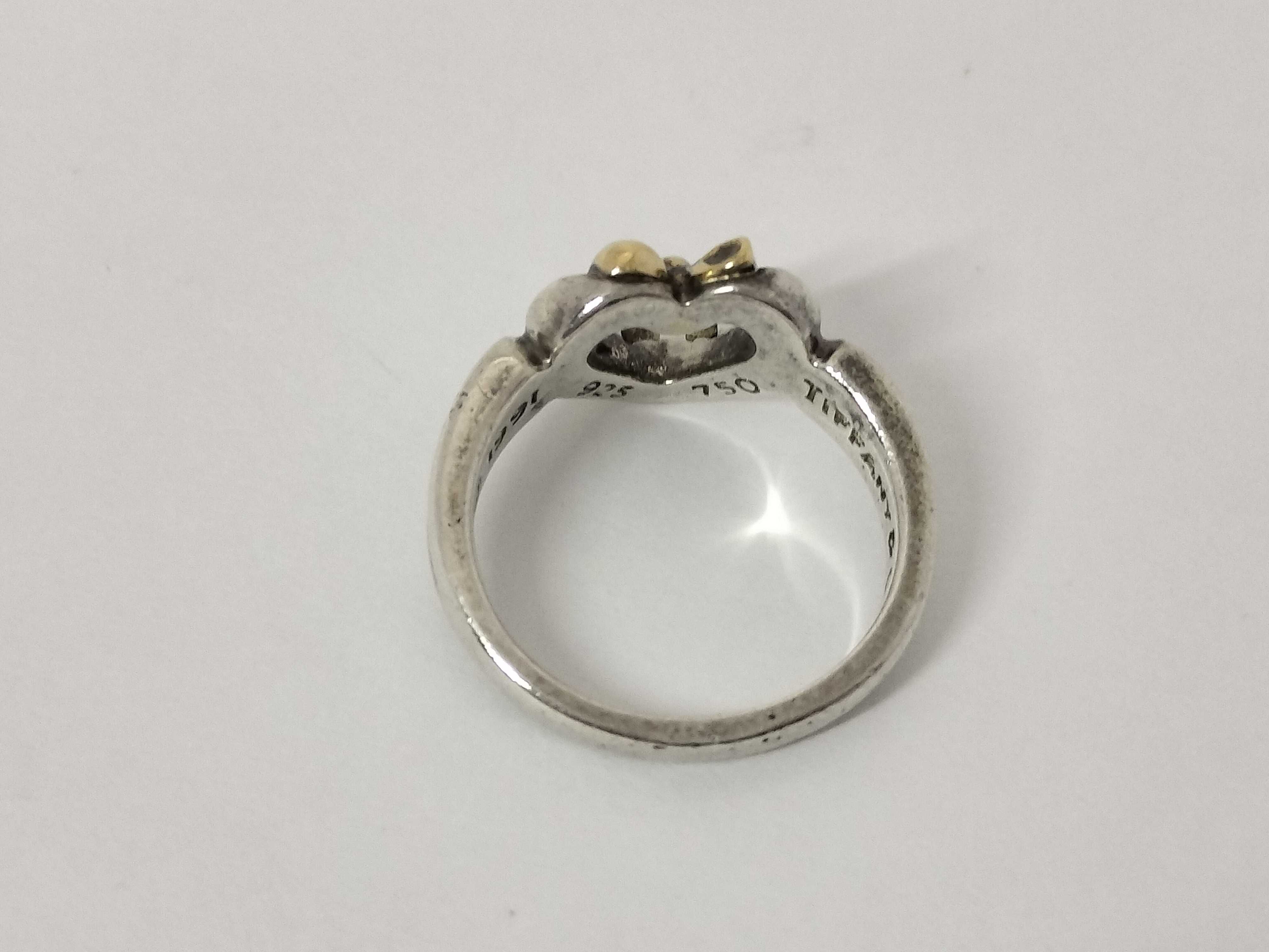 Tiffany & Co. 1991 Sterling Silver and 18K Yellow Gold Heart and Bow Ring