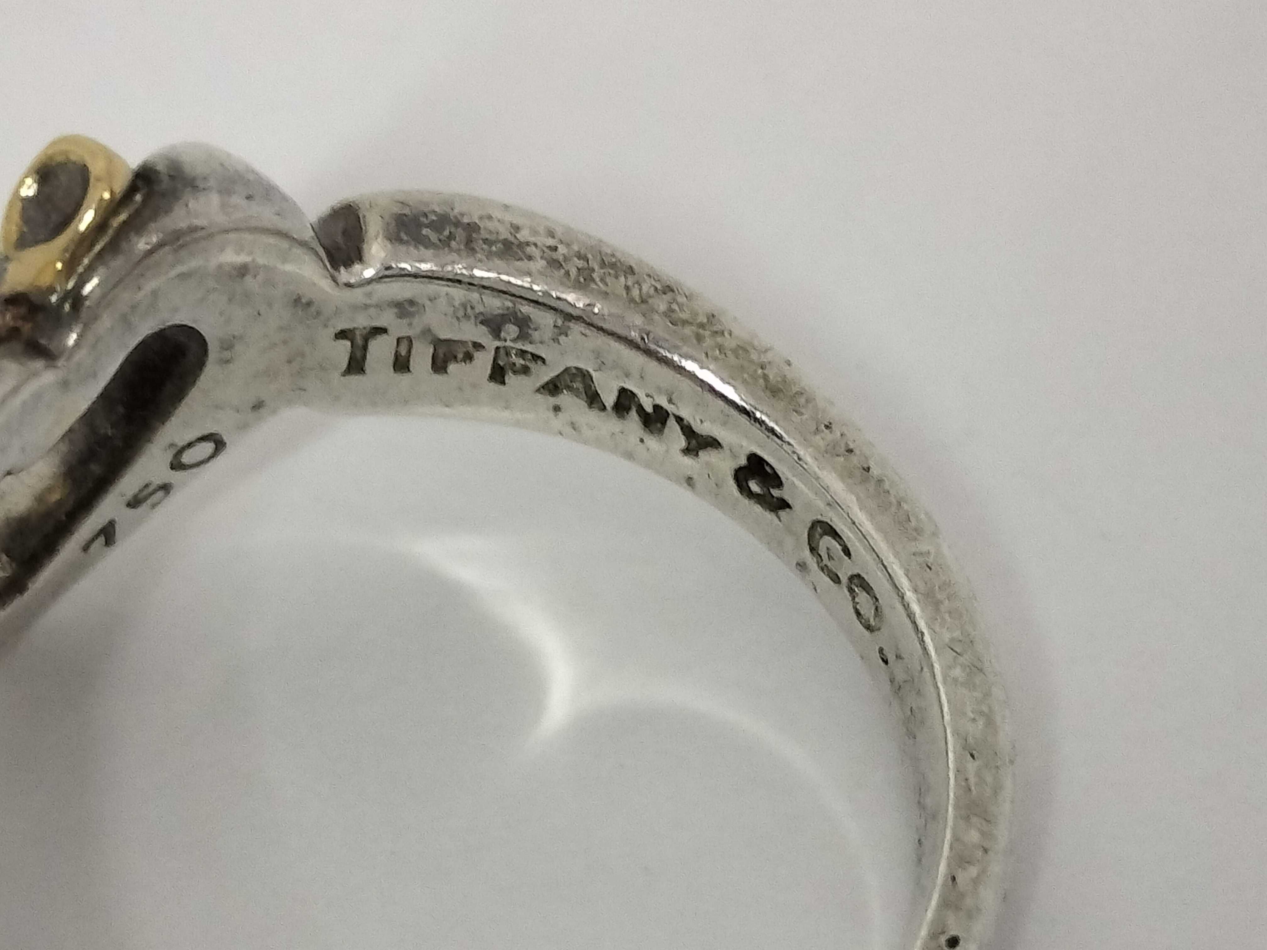 Tiffany & Co. 1991 Sterling Silver and 18K Yellow Gold Heart and Bow Ring