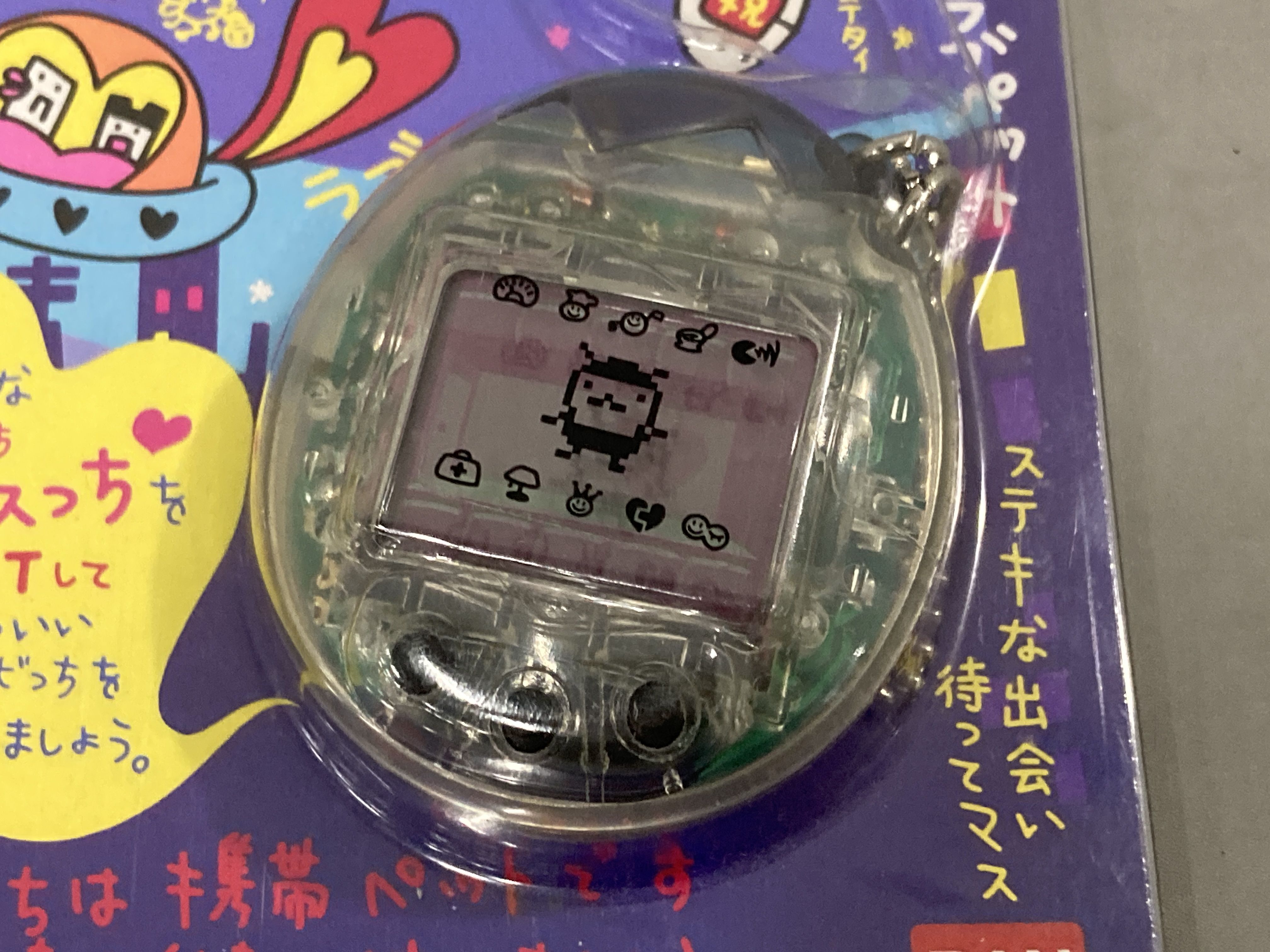 A Pair of Bandai Tamagotchi Osutchi and Mesutchi Handheld Digital Pet Games, 1997