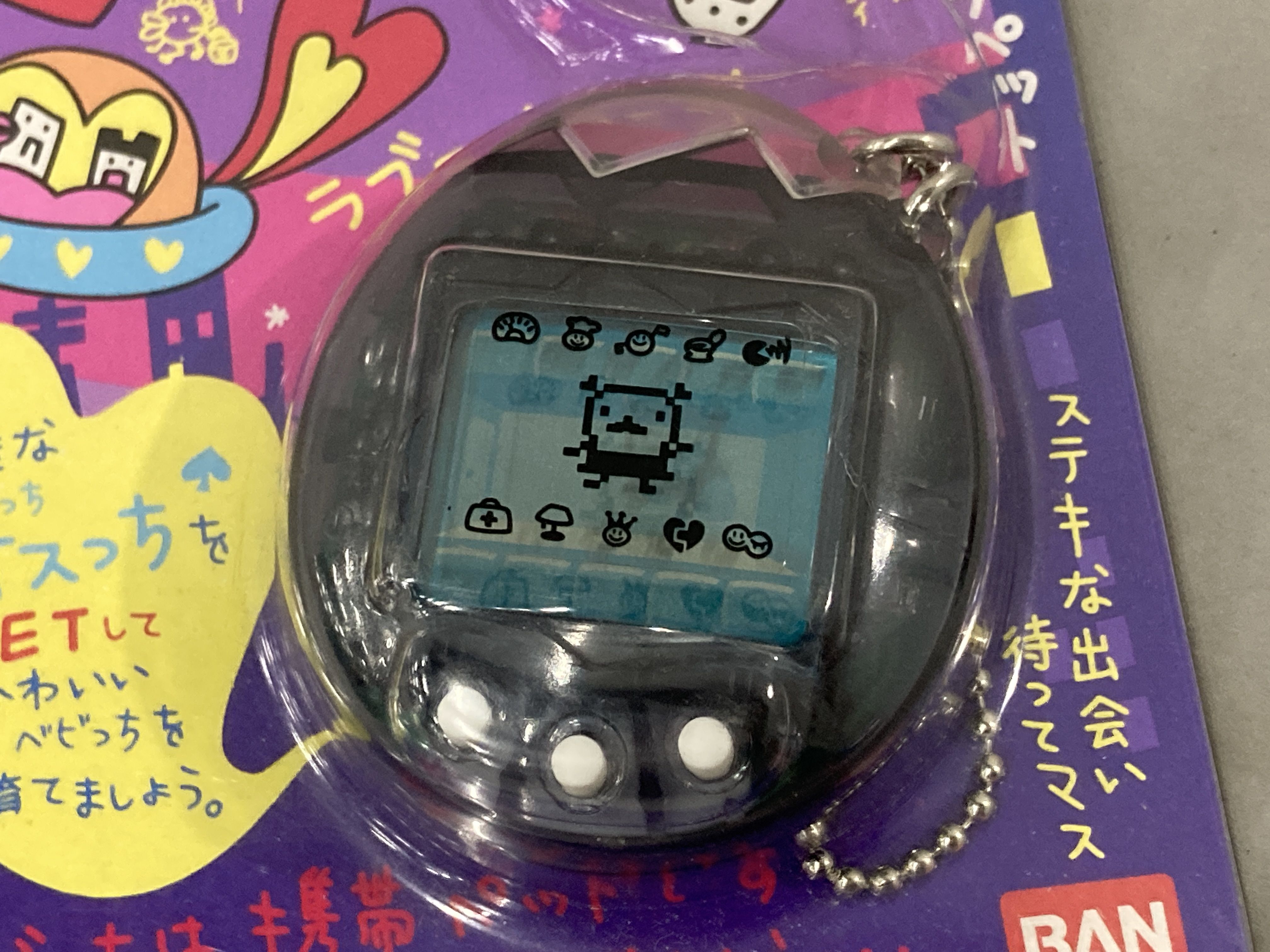 A Pair of Bandai Tamagotchi Osutchi and Mesutchi Handheld Digital Pet Games, 1997