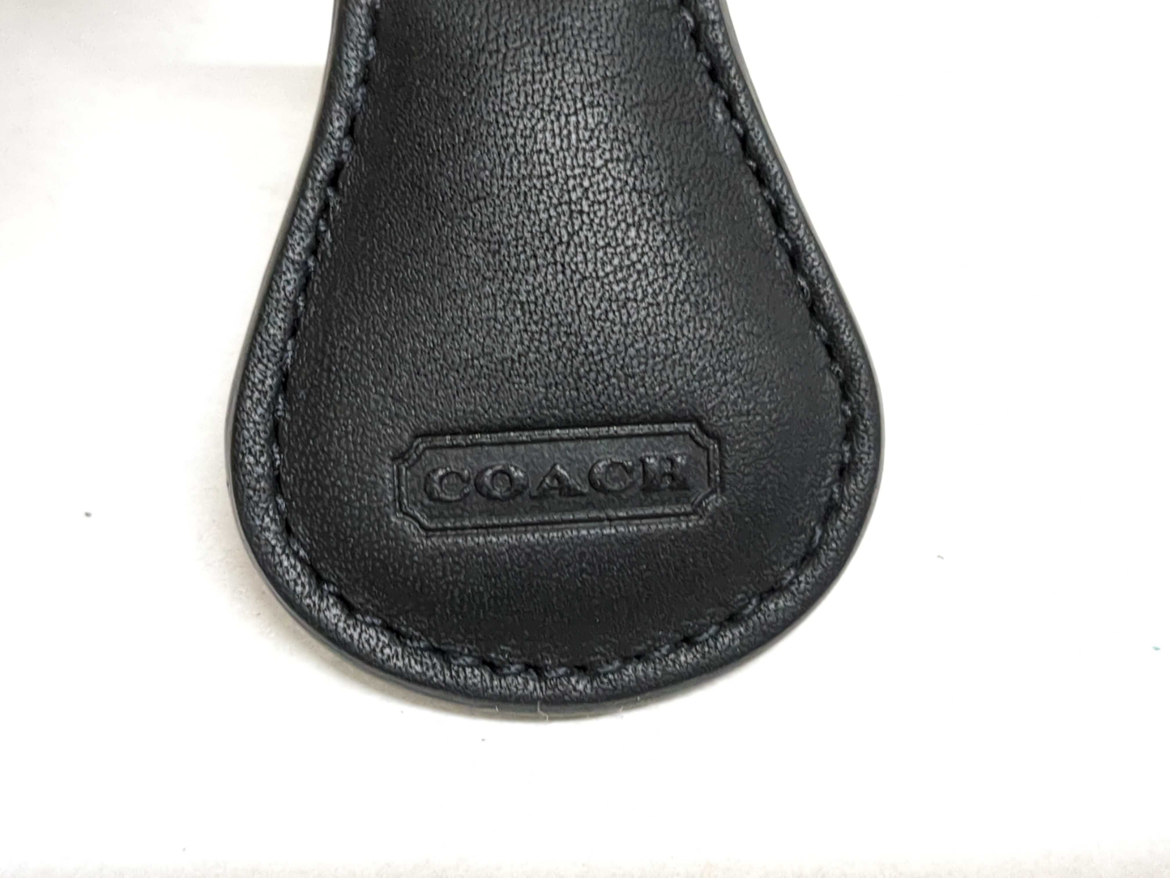 An Assortment of Designer Leather Wallets and Keychains Including Orobianco, Emporio Armani, and Il Bisonte