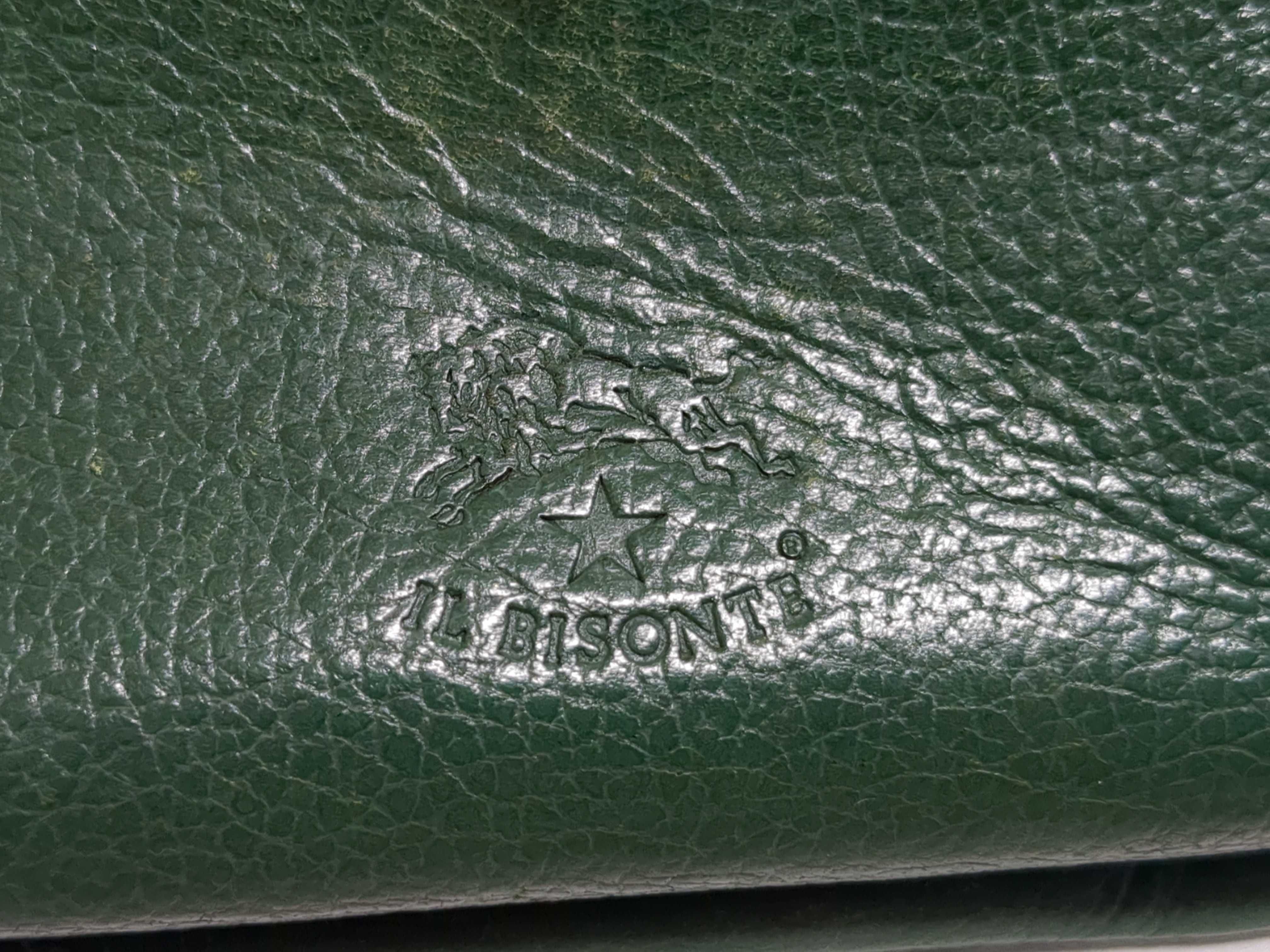 An Assortment of Designer Leather Wallets and Keychains Including Orobianco, Emporio Armani, and Il Bisonte