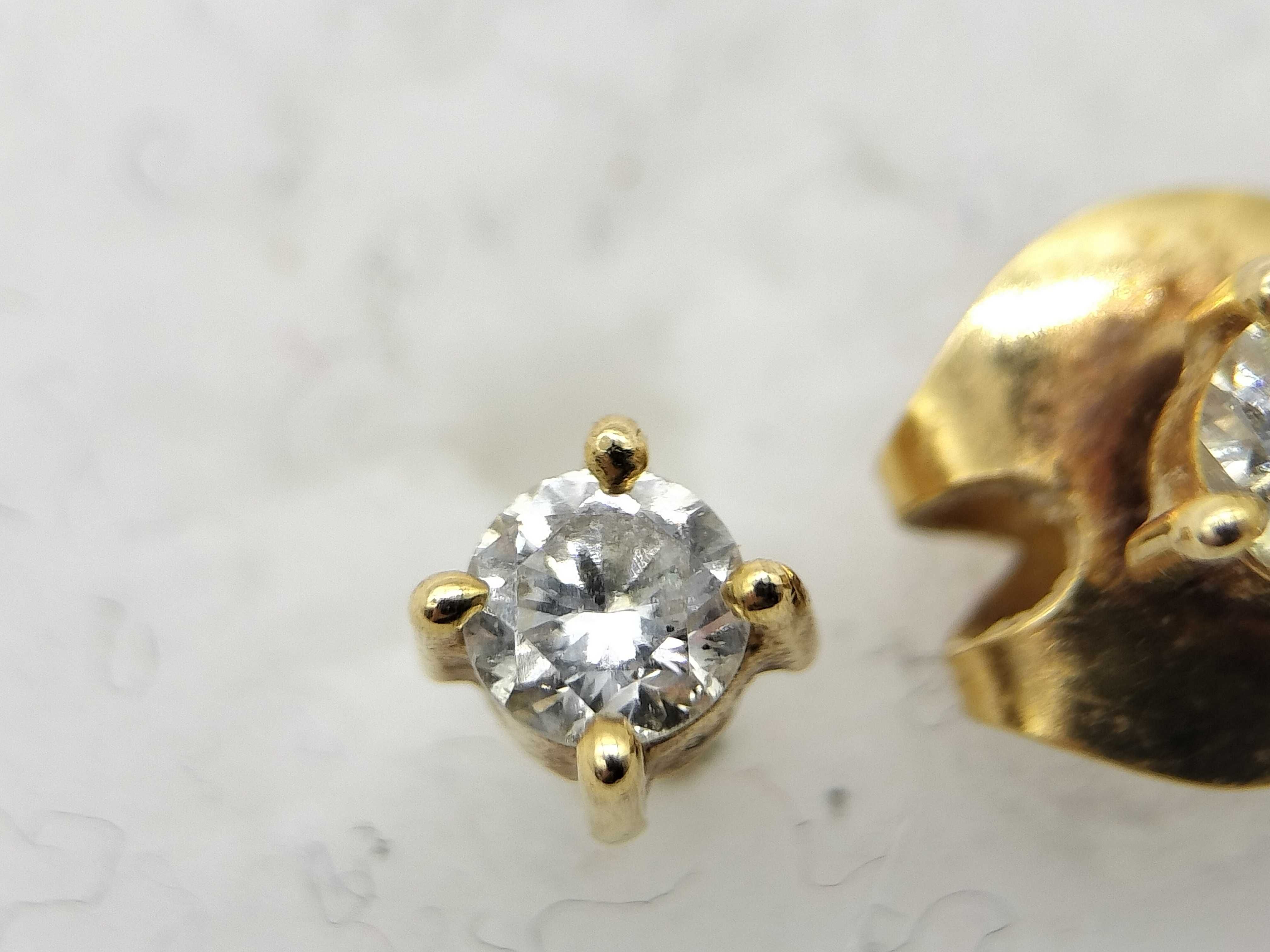 A Pair of Diamond Stud Earrings in 14 Karat Yellow Gold