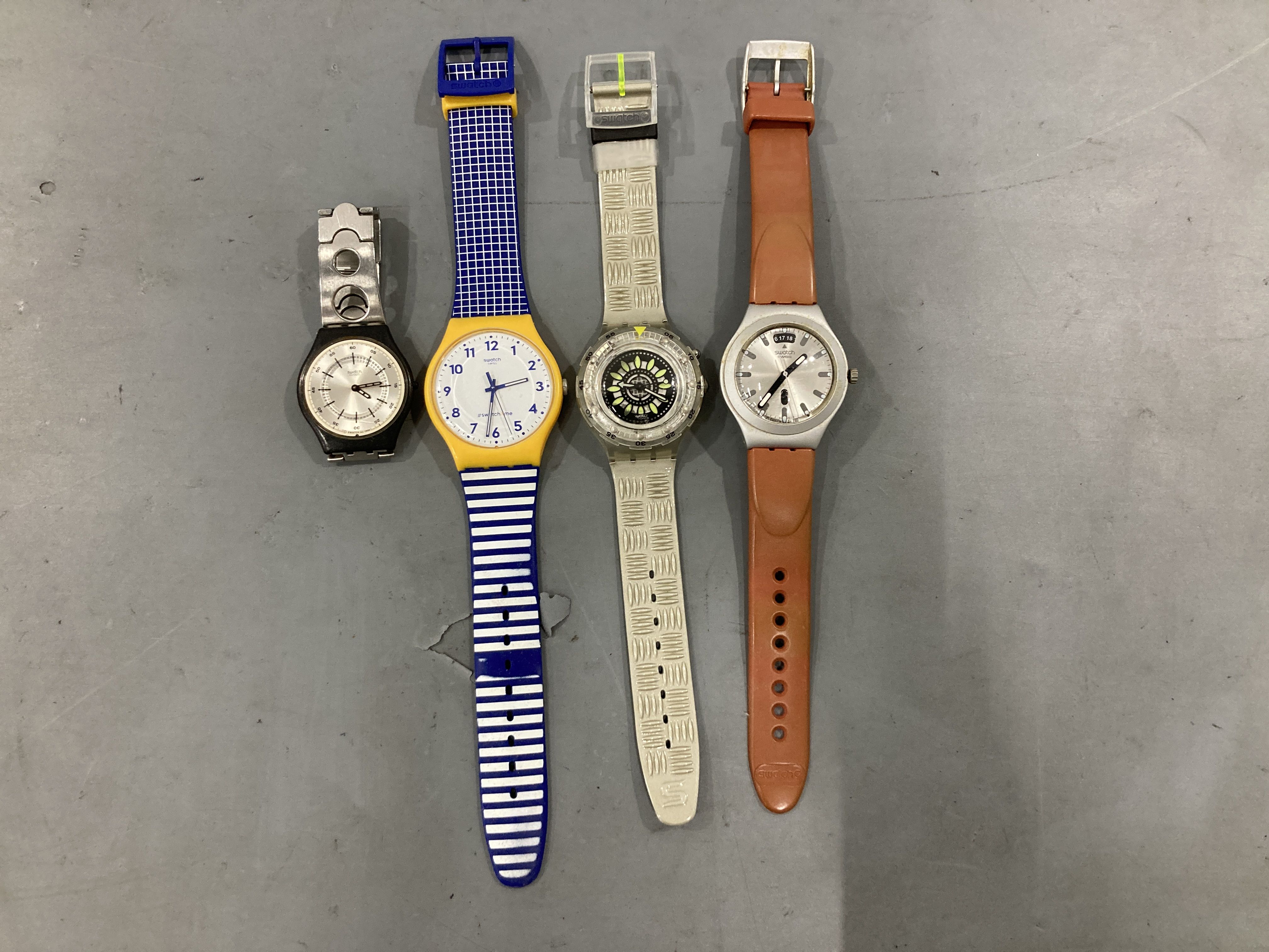 A Collection of Approximately 25 Swatch Wristwatches