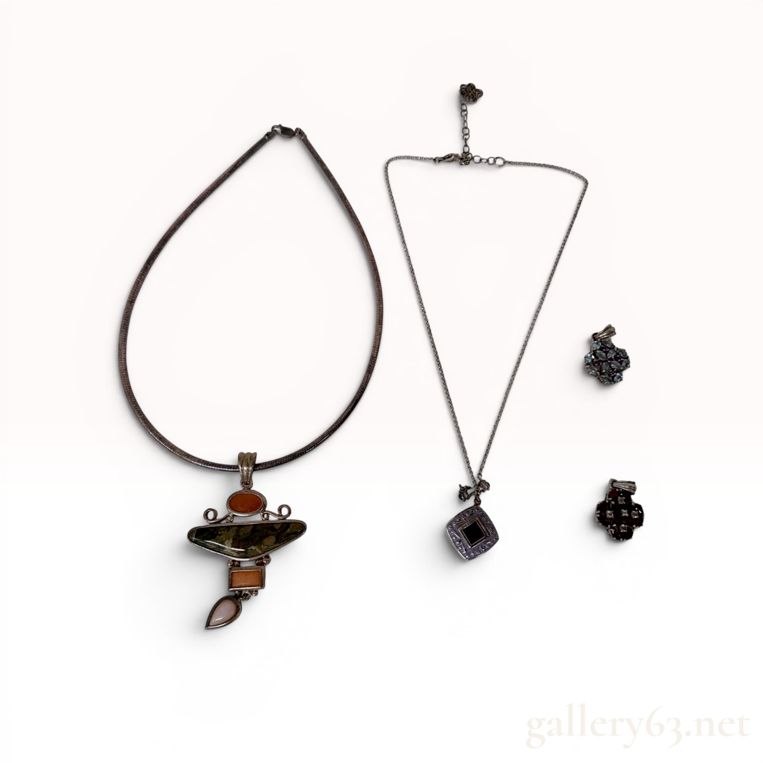 A Collection of Four Sterling Silver and Gemstone Jewelry Items
