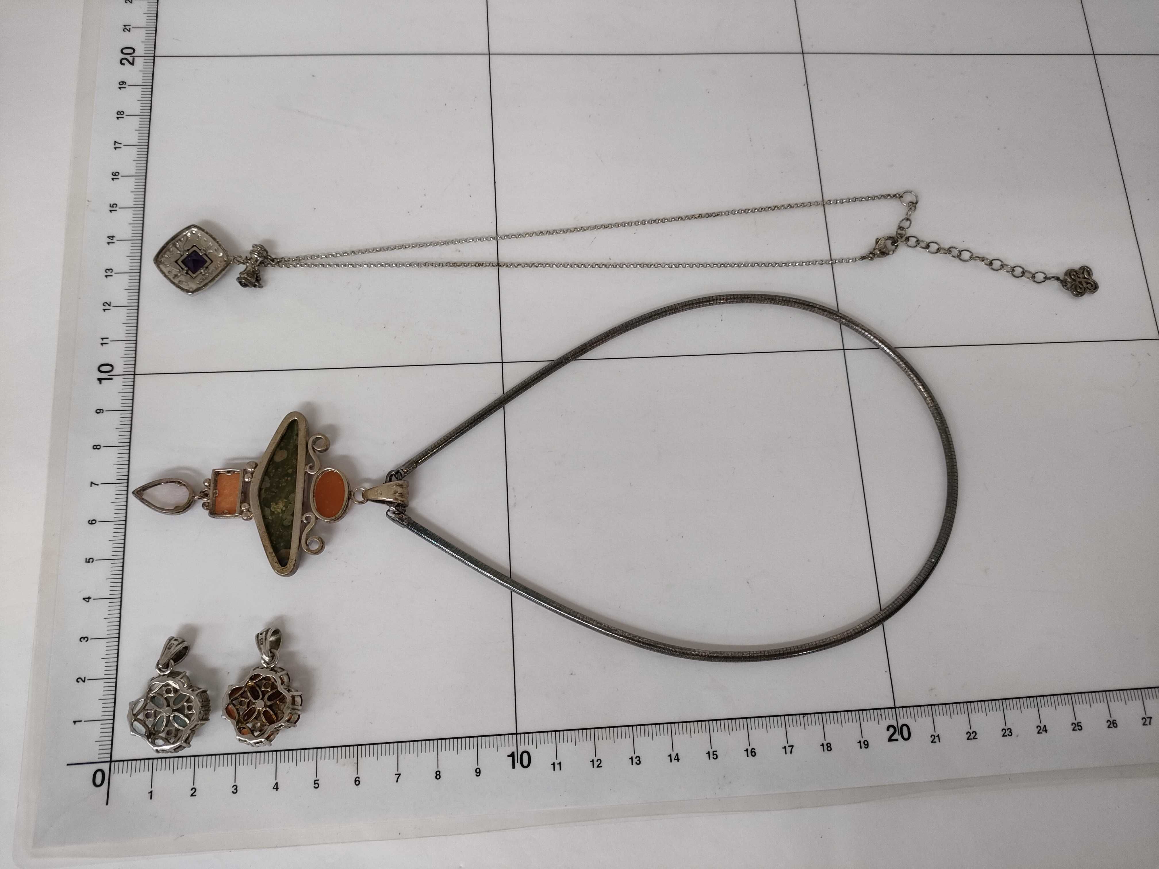 A Collection of Four Sterling Silver and Gemstone Jewelry Items