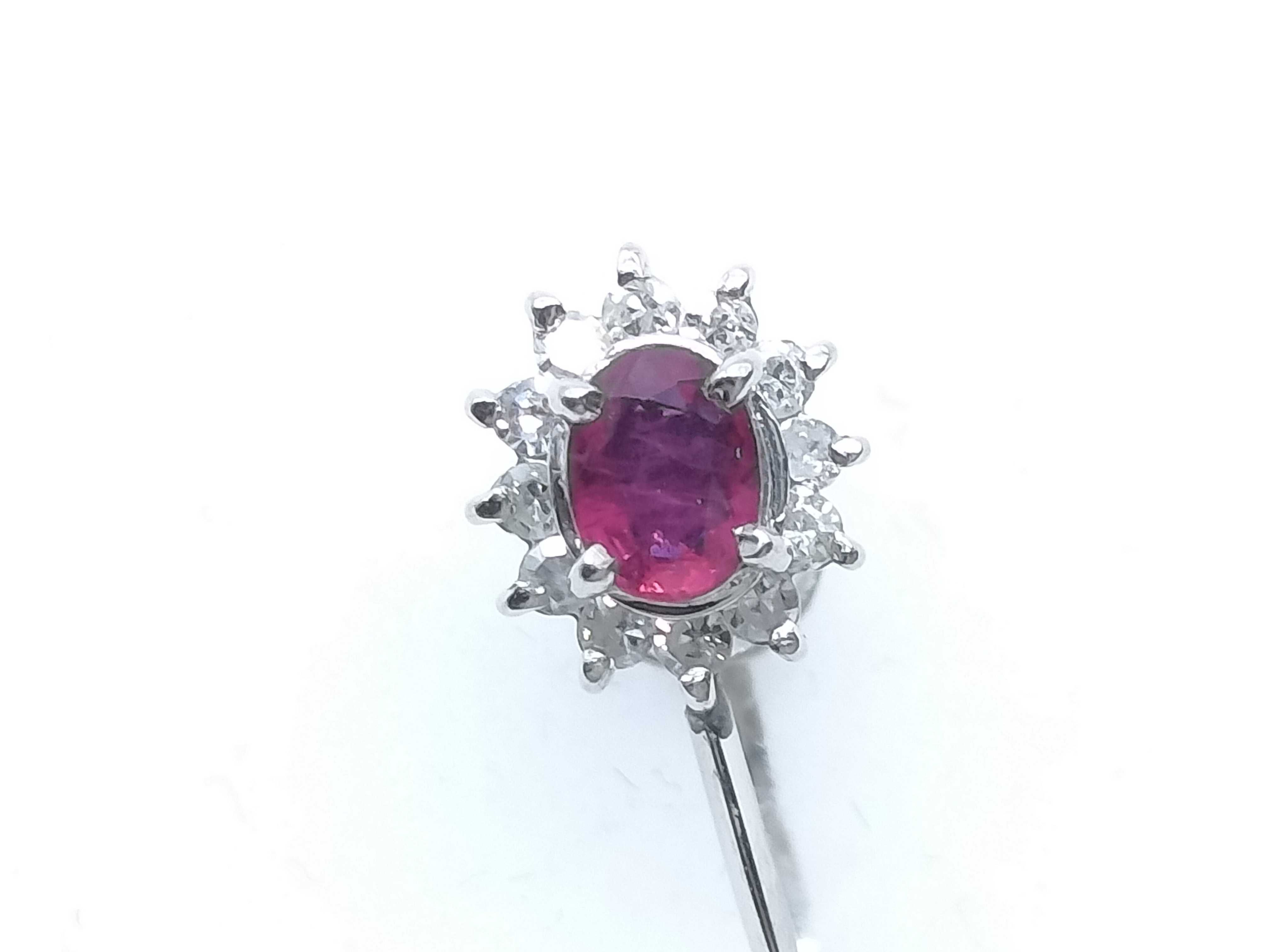 A Pair of Platinum, Ruby, and Diamond Cluster Screw-Back Earrings