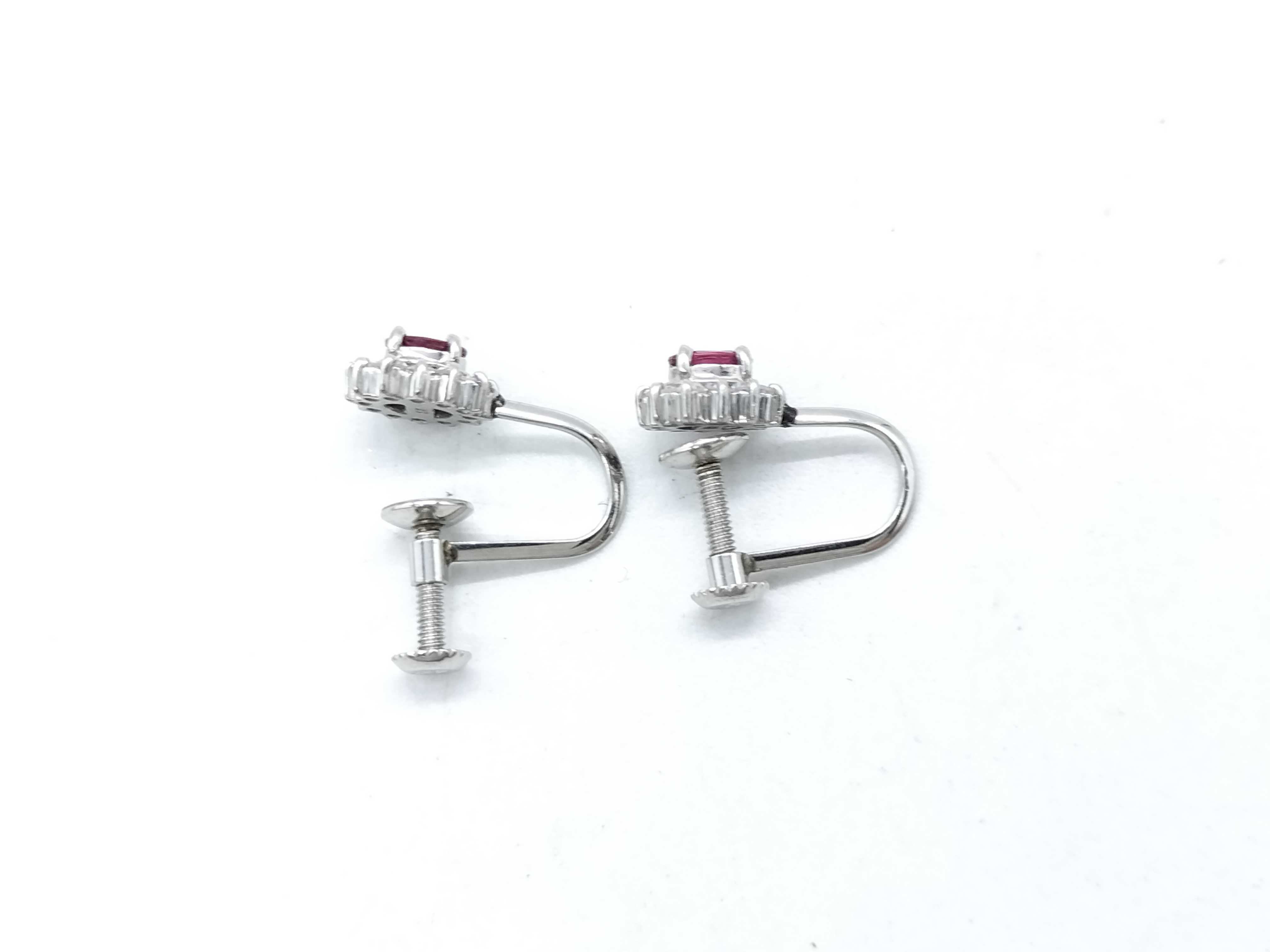 A Pair of Platinum, Ruby, and Diamond Cluster Screw-Back Earrings
