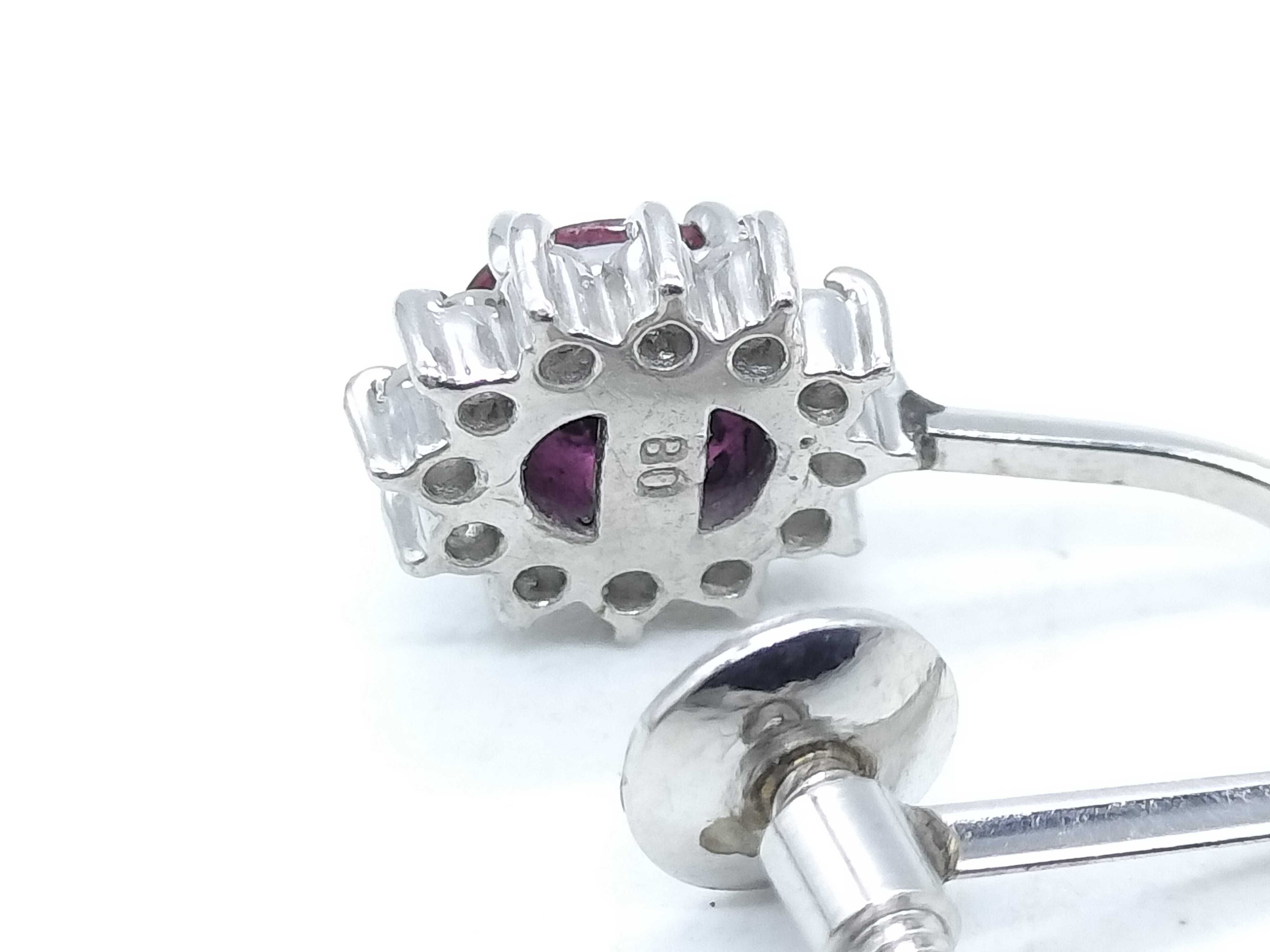 A Pair of Platinum, Ruby, and Diamond Cluster Screw-Back Earrings