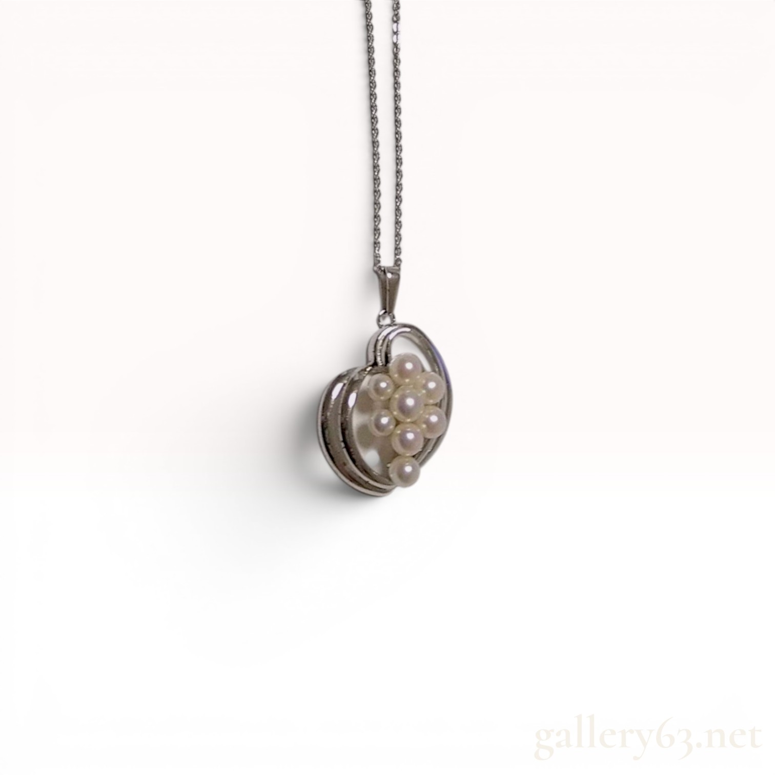 A Trio of Silver Jewelry Items Including a Mikimoto Cultured Pearl Necklace