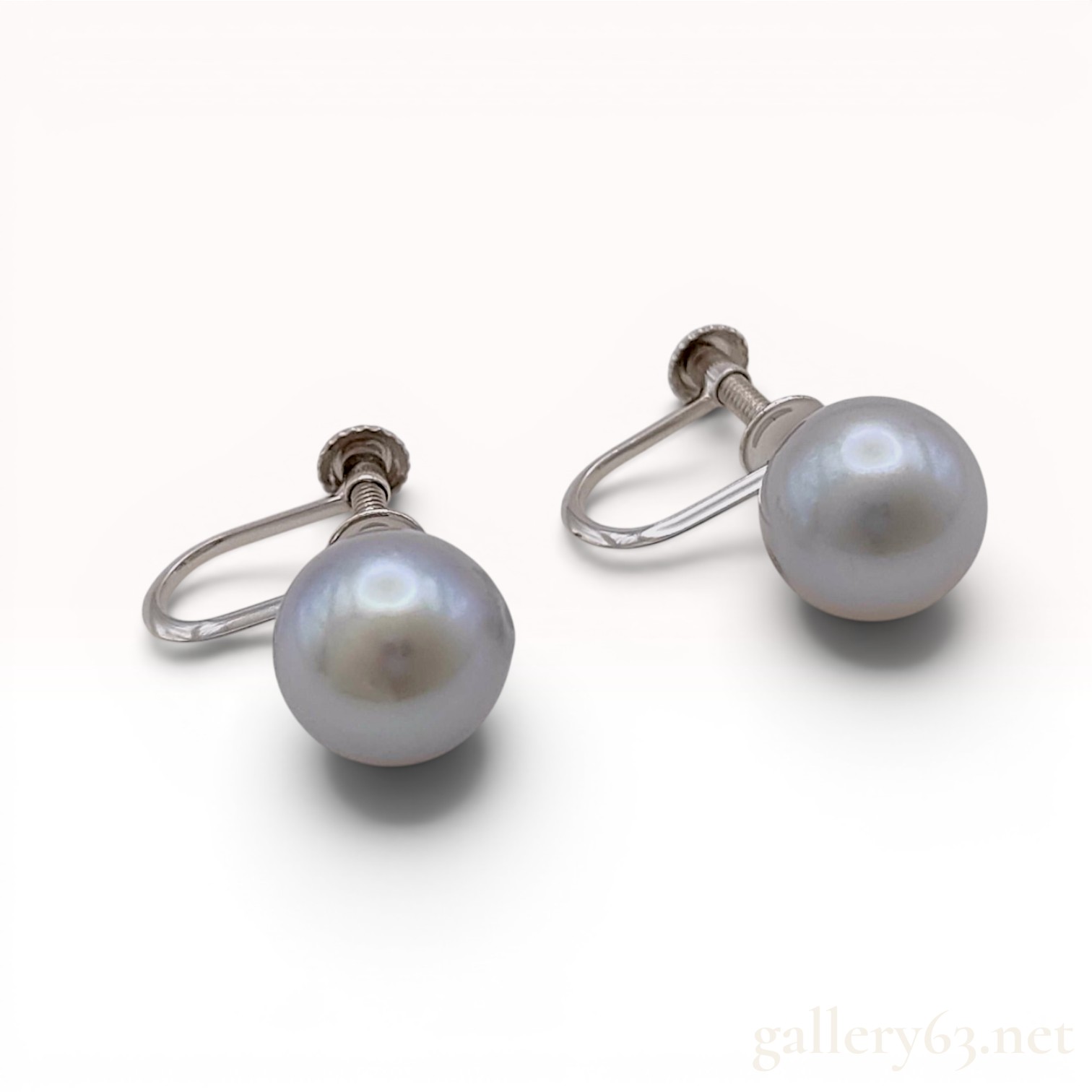 A Pair of Grey Cultured Pearl and 14 Karat White Gold Screw-Back Earrings