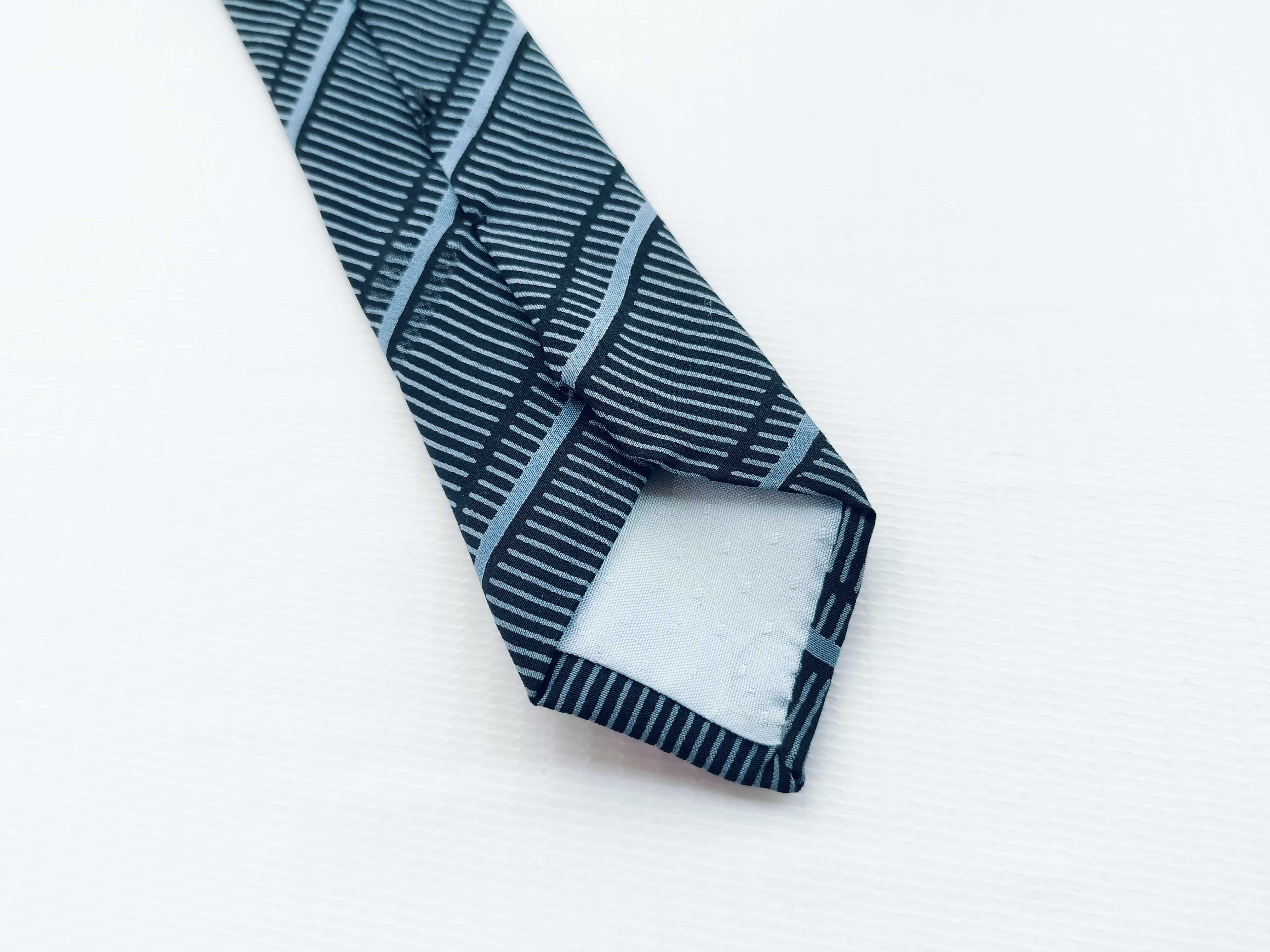 A Collection of Six Designer Silk Neckties Including Salvatore Ferragamo, Fendi, and Yves Saint Laurent