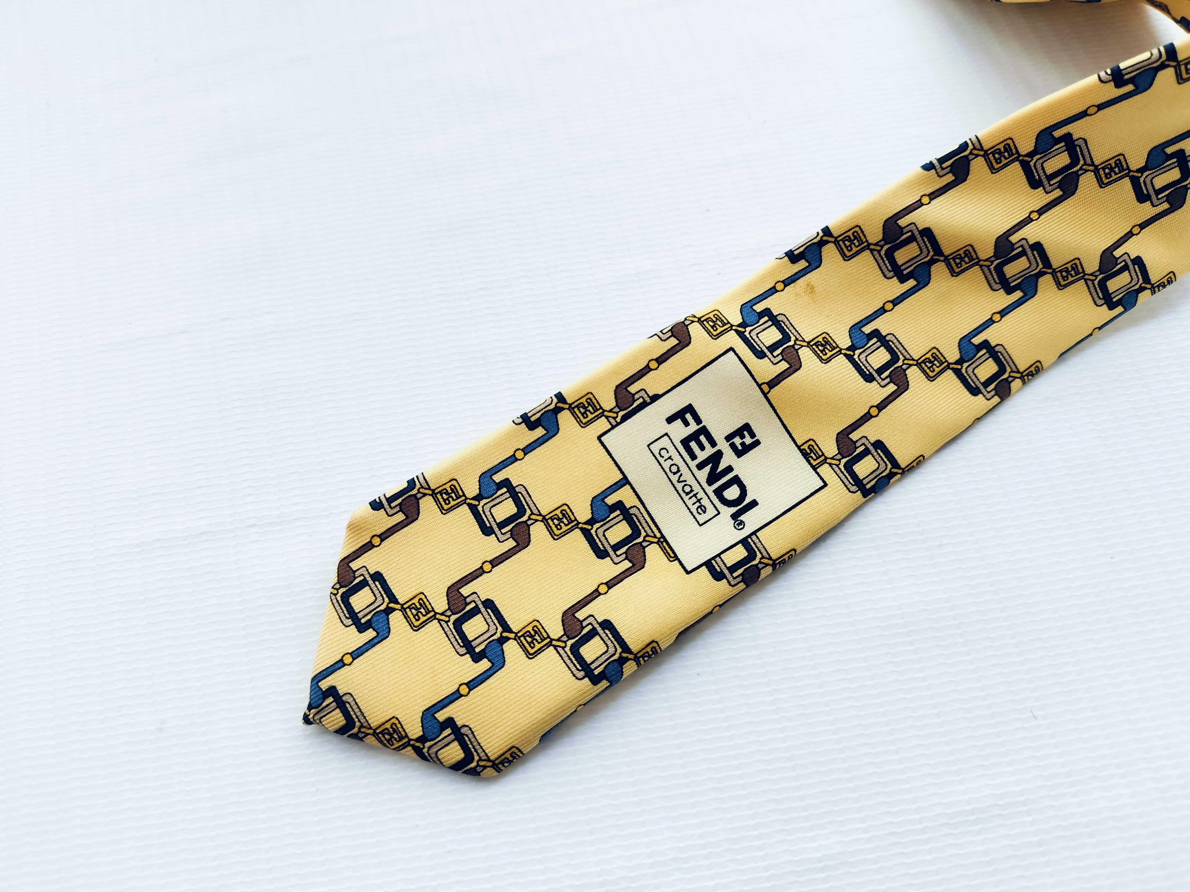 A Collection of Six Designer Silk Neckties Including Salvatore Ferragamo, Fendi, and Yves Saint Laurent