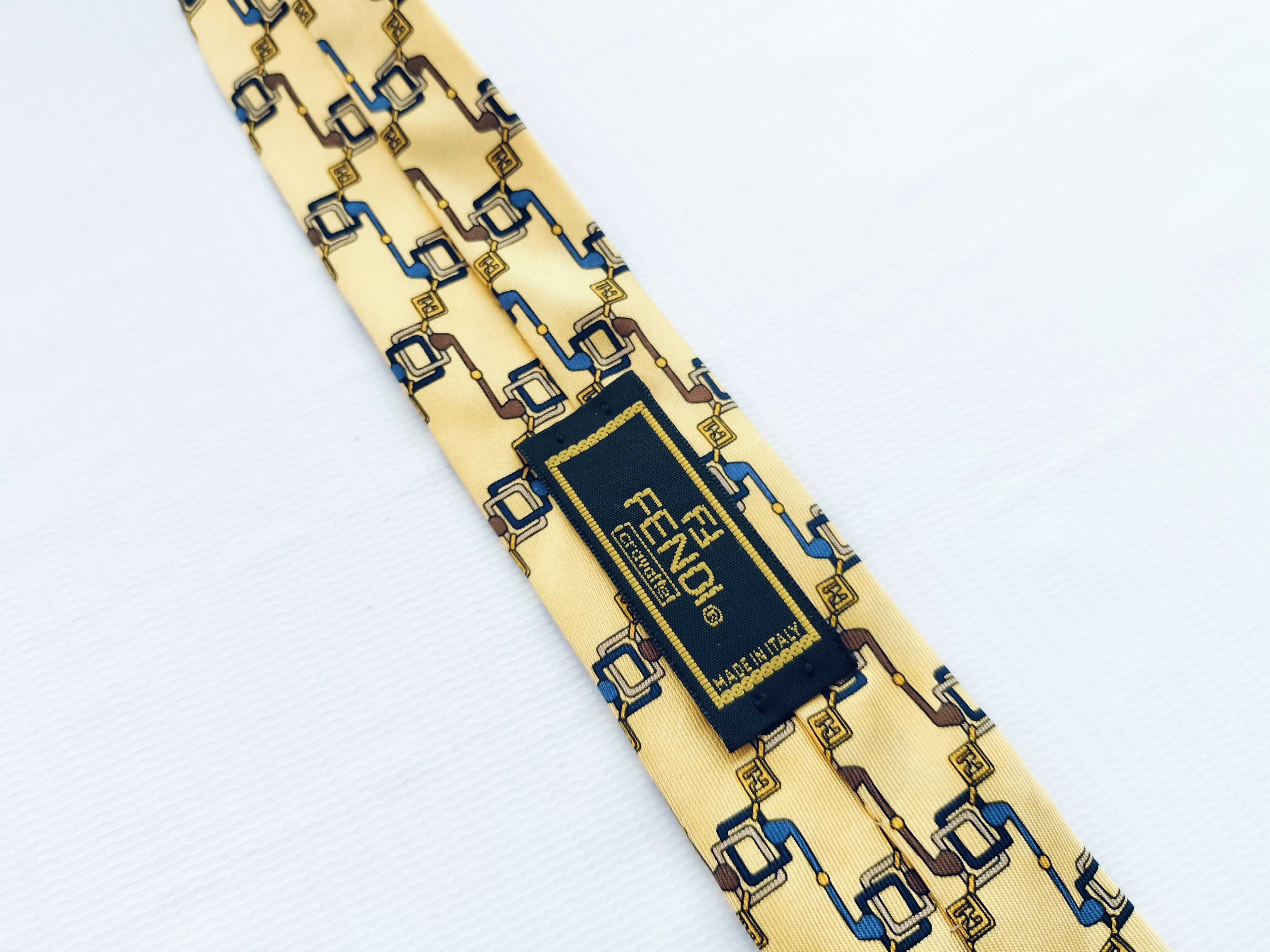 A Collection of Six Designer Silk Neckties Including Salvatore Ferragamo, Fendi, and Yves Saint Laurent