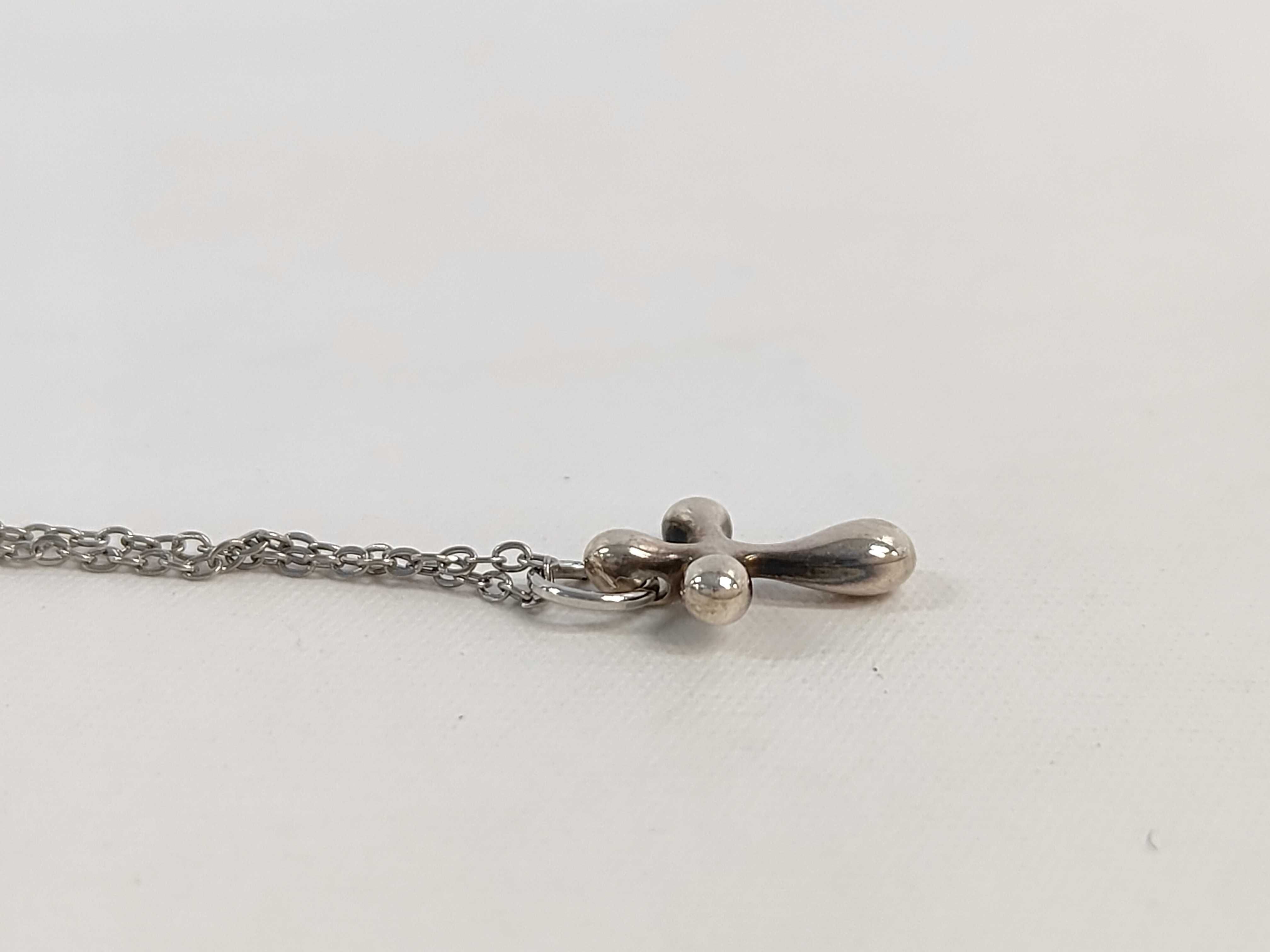 Stainless Steel Small Cross Pendant Necklace in the Style of Elsa Peretti