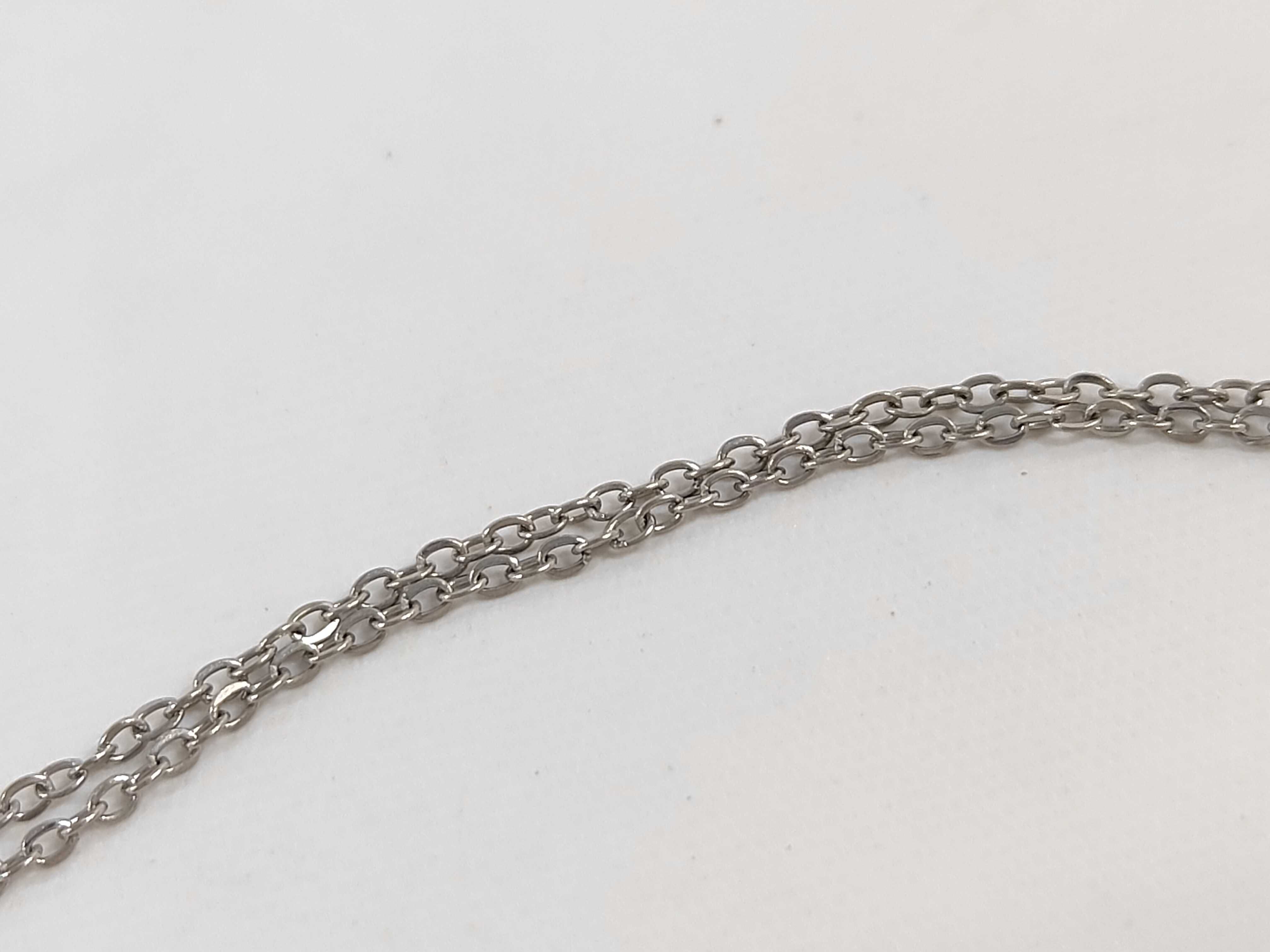 Stainless Steel Small Cross Pendant Necklace in the Style of Elsa Peretti