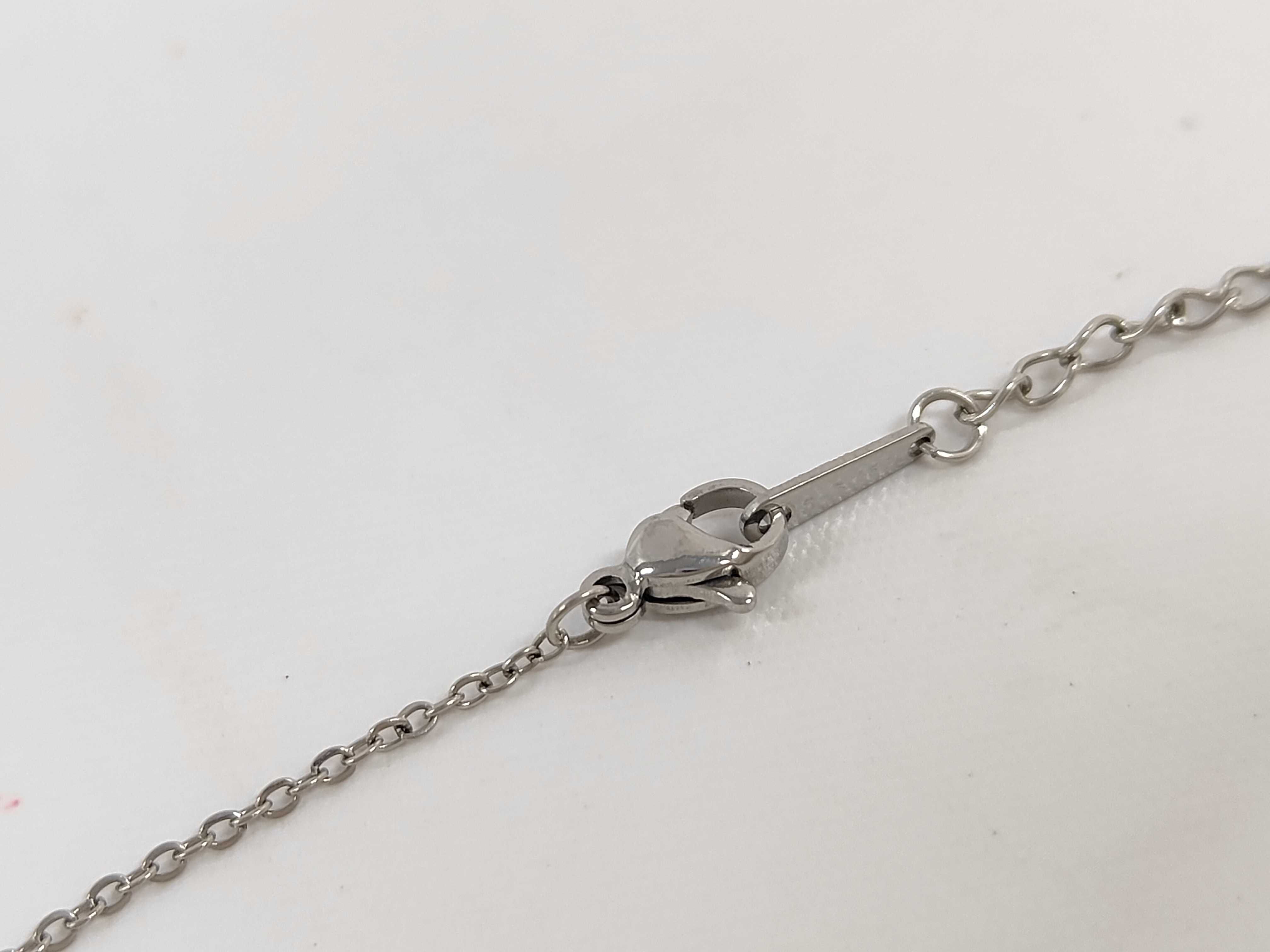 Stainless Steel Small Cross Pendant Necklace in the Style of Elsa Peretti