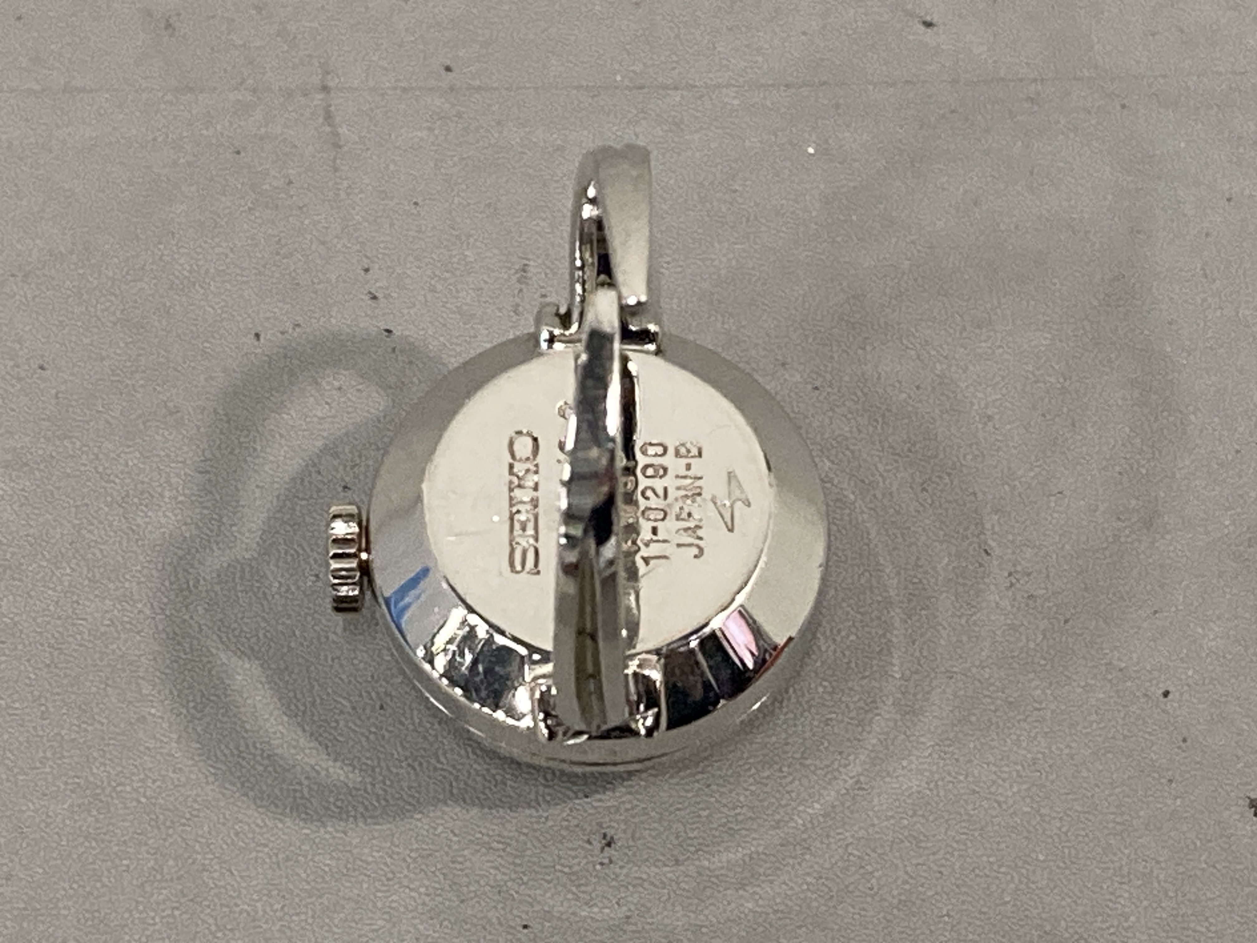 Two Vintage Seiko 17-Jewel Manual-Wind Specialty Watches: Ring Watch 11-0290 and Triangular Pendant Watch 11-8360