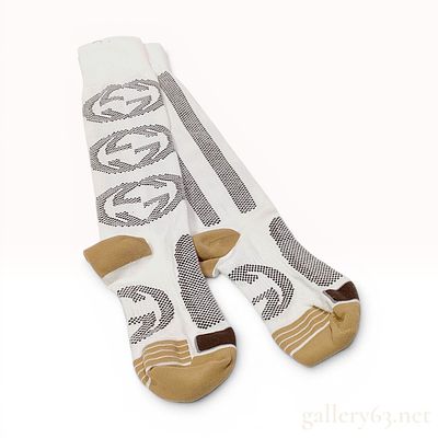 A Pair of Gucci Interlocking GG Stripe Knee-High Socks. A pair of Gucci designer knee-high socks 