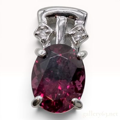 Platinum, 2.61ct Rhodolite Garnet, and Diamond Pendant. A platinum pendant featuring a central 