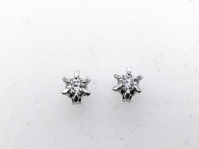 A Pair of Diamond and Platinum Flower Style Stud Earrings. A matched pair of diamond stud 