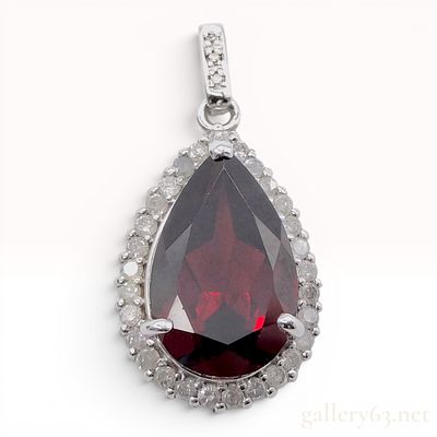 14K White Gold Pear-Cut Garnet and Diamond Halo Pendant. A 14-karat white gold pendant featuring 