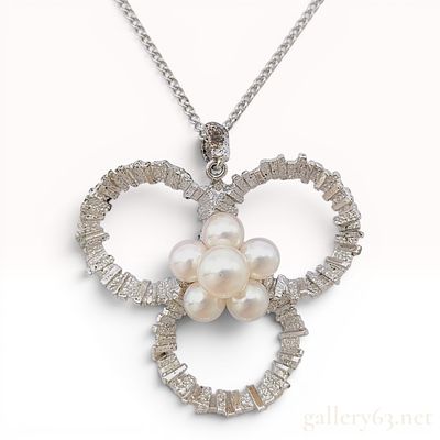 Mikimoto Cultured Pearl and Silver Textured Trefoil Pendant Necklace. A silver and cultured 