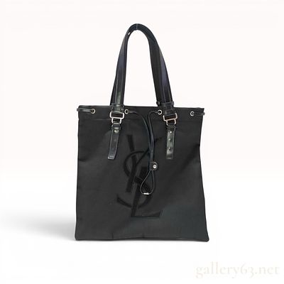 Yves Saint Laurent Black Canvas Kahala Tote Bag. This bag is a Yves Saint Laurent Kahala tote 