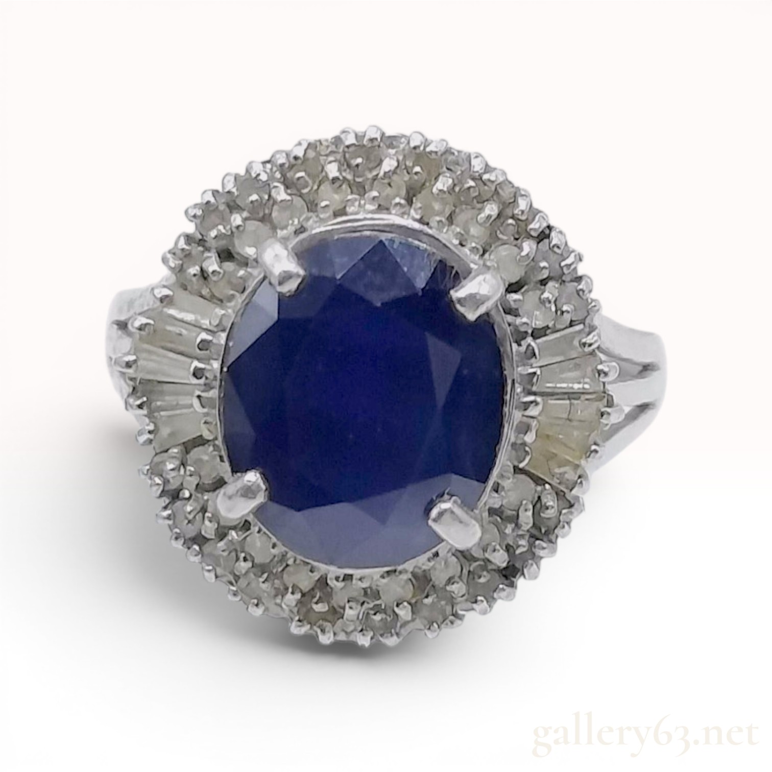 Platinum 3.0 Carat Oval Blue Sapphire and 0.35ctw Diamond Ballerina Halo Ring