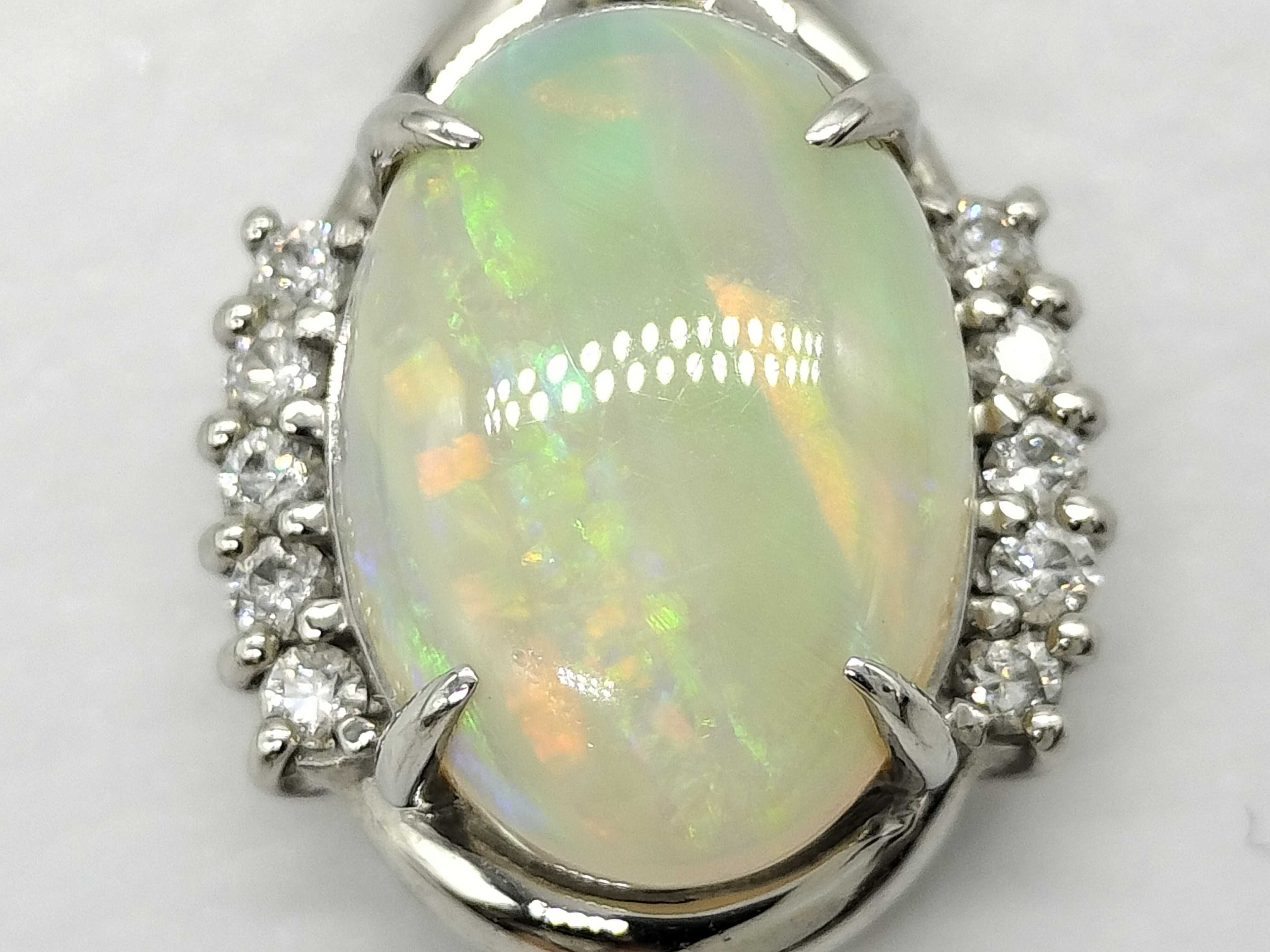 Platinum 2.95 Carat Opal and 0.15 Carat Diamond Bypass Cluster Pendant