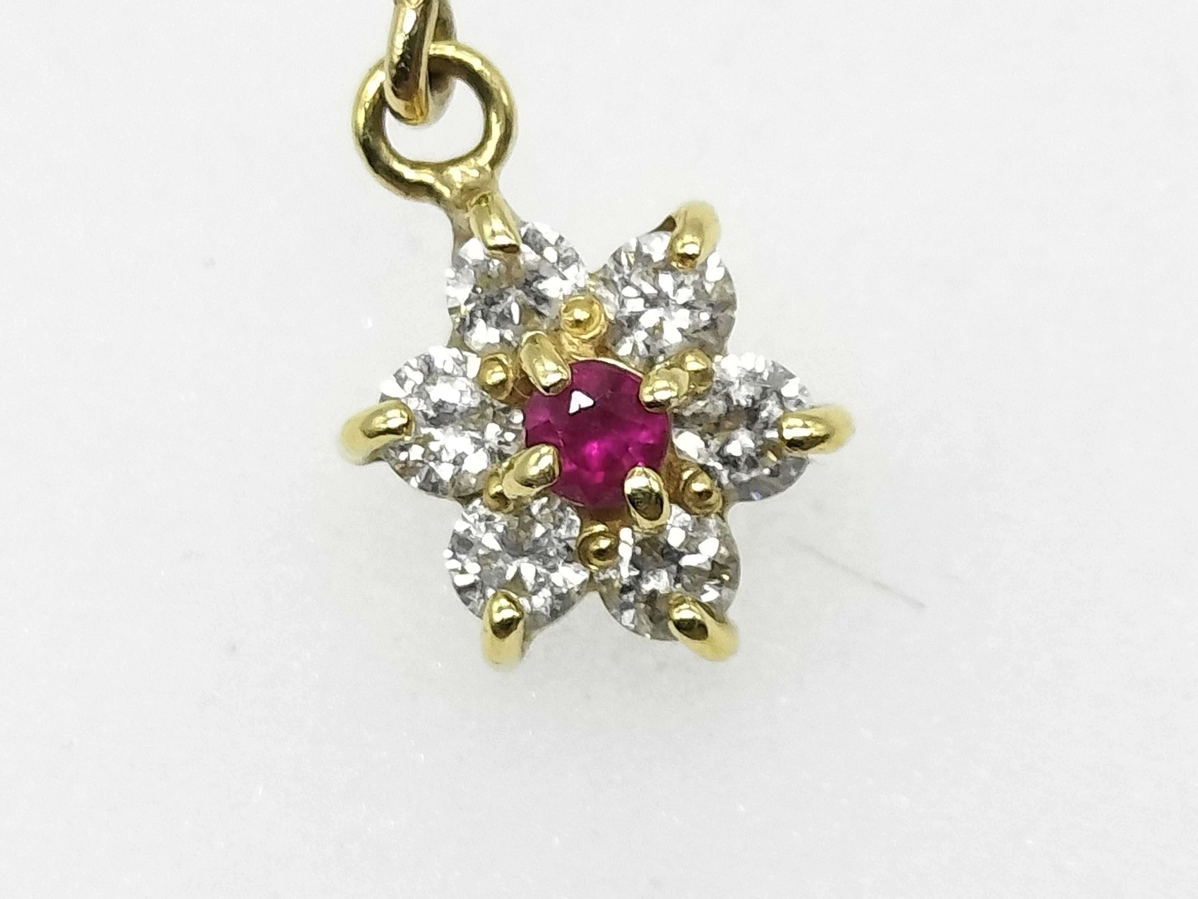 A Pair of 18 Karat Yellow Gold Ruby and Diamond Floral Cluster Drop Earrings
