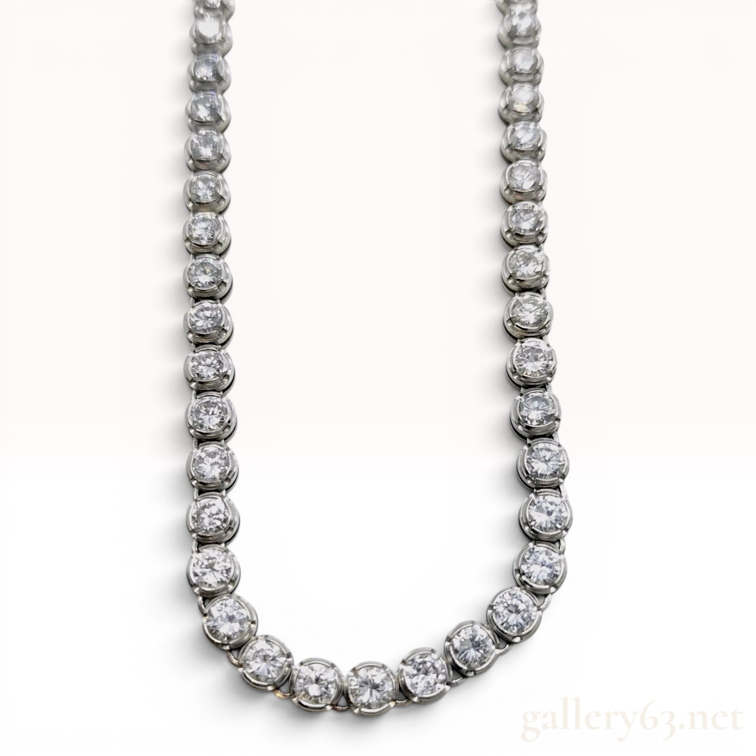 A Platinum and 10.00ctw Natural Diamond Graduated Tennis Necklace