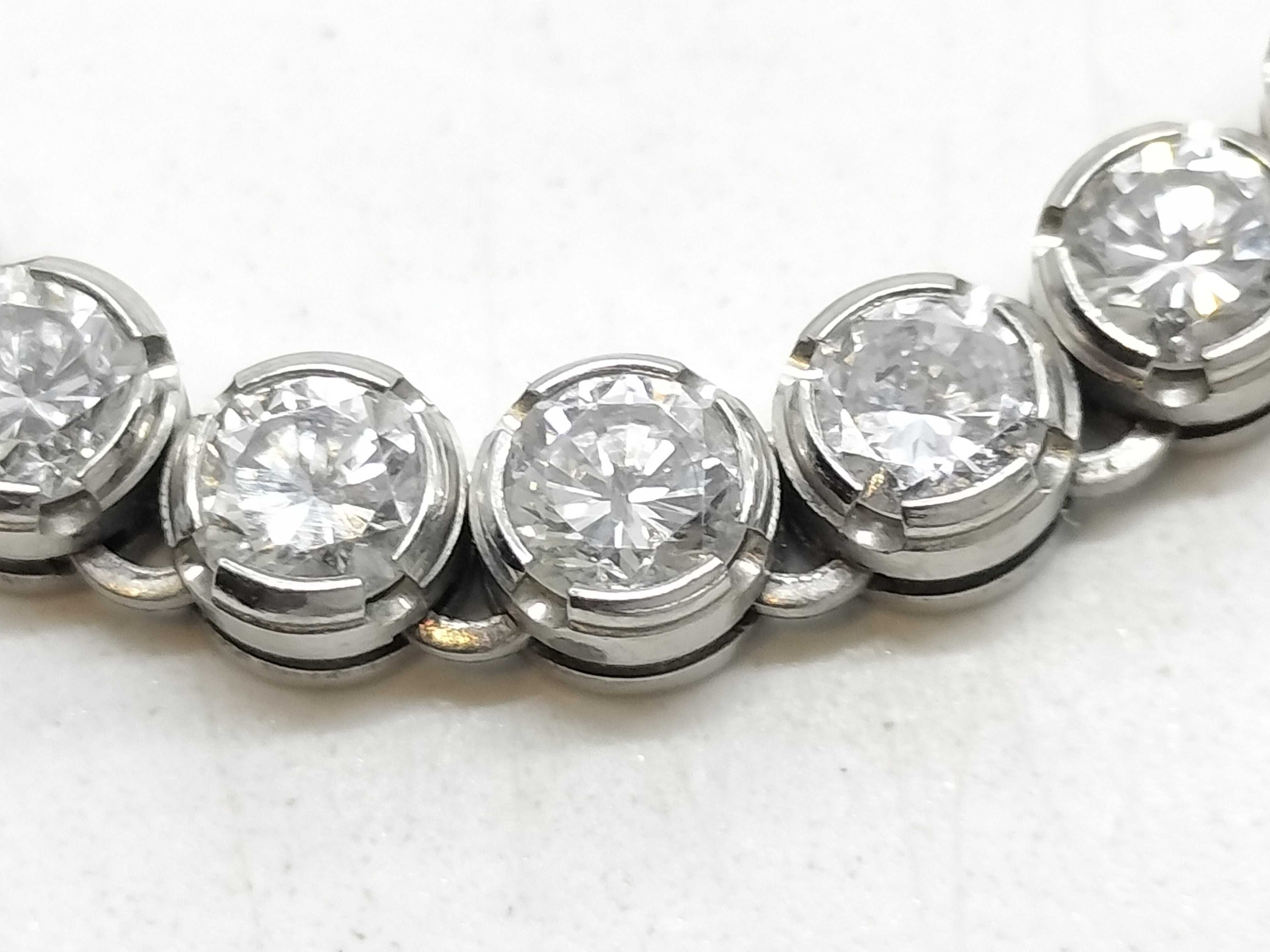 A Platinum and 10.00ctw Natural Diamond Graduated Tennis Necklace