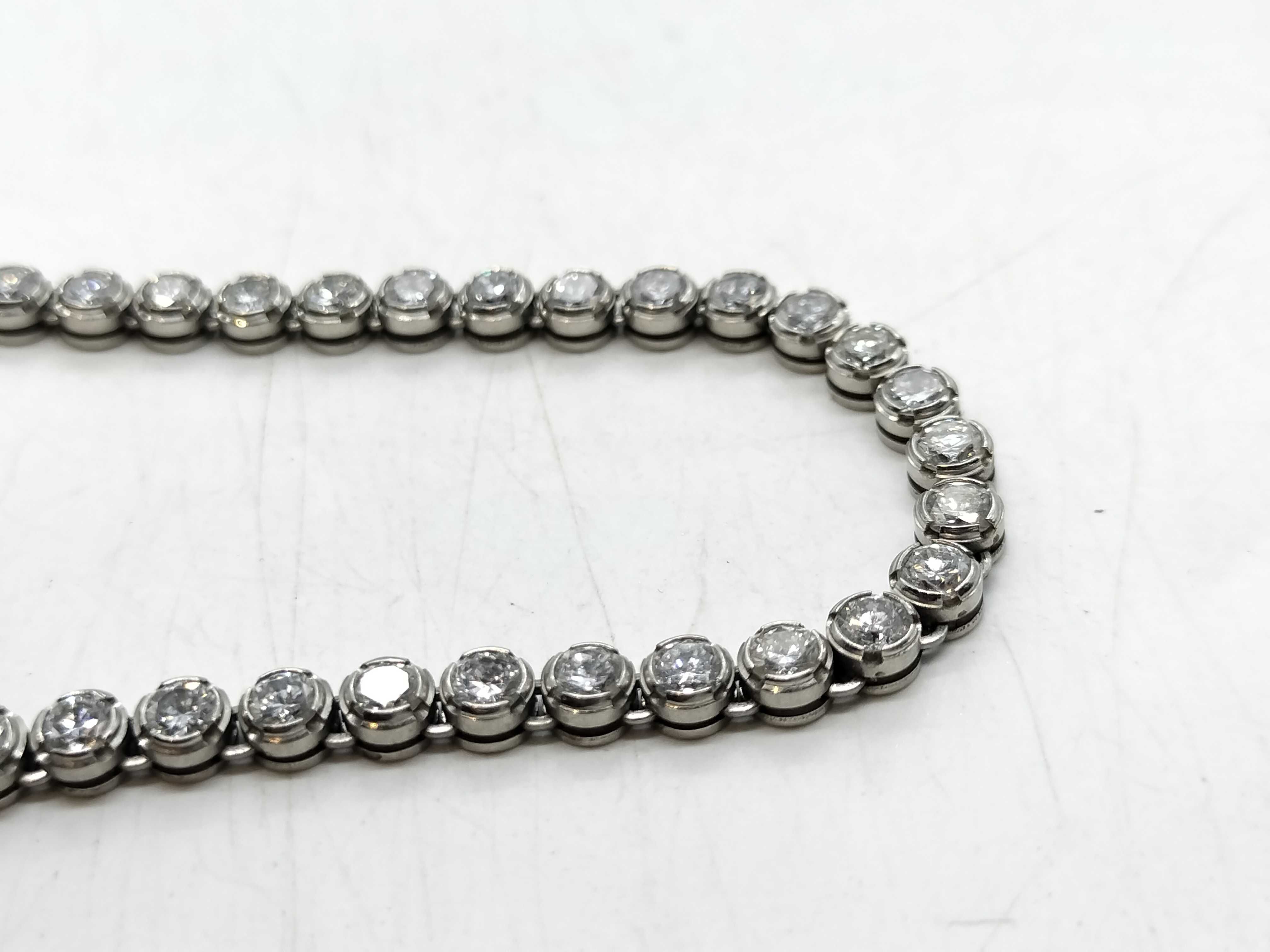 A Platinum and 10.00ctw Natural Diamond Graduated Tennis Necklace