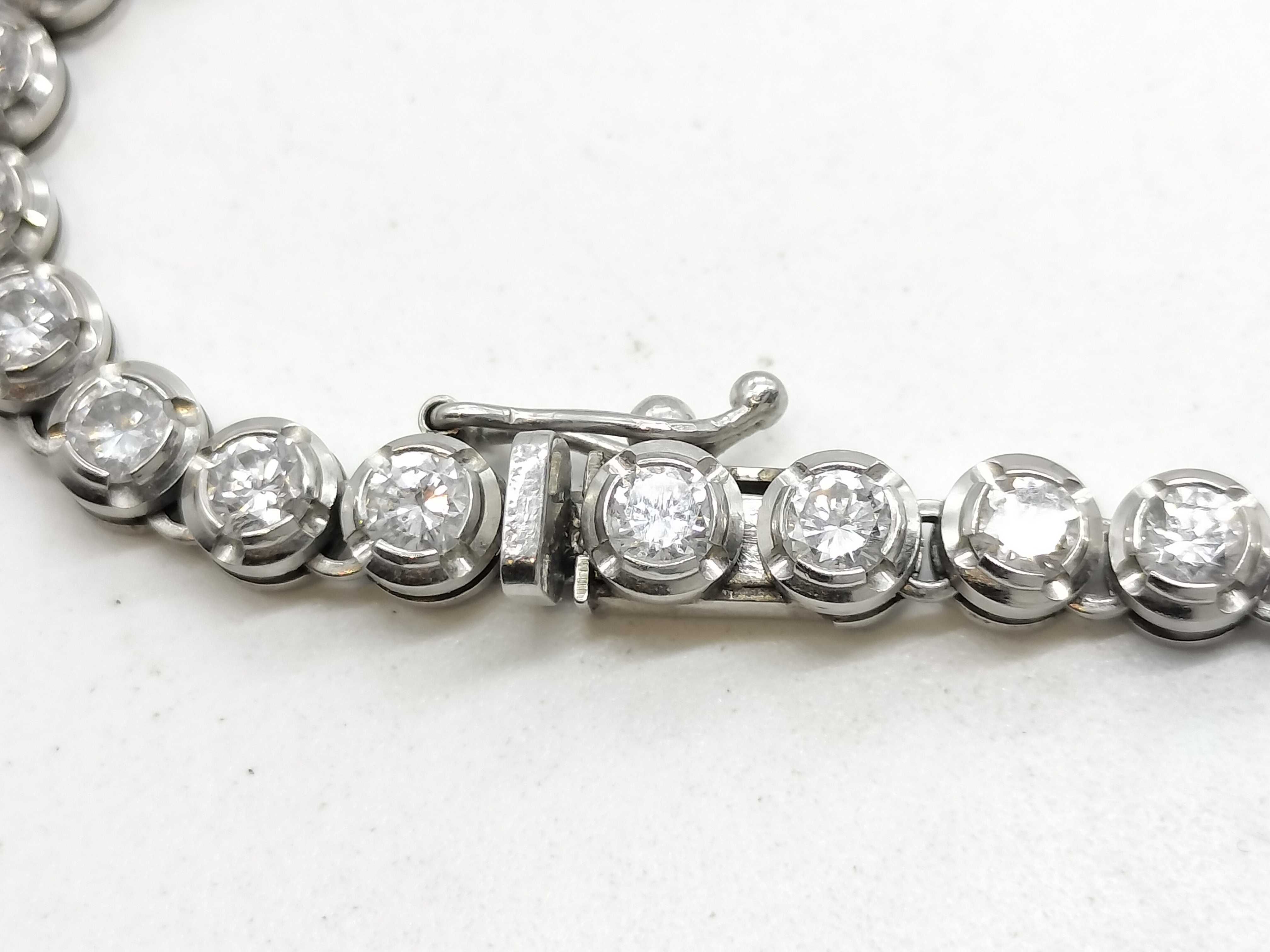 A Platinum and 10.00ctw Natural Diamond Graduated Tennis Necklace