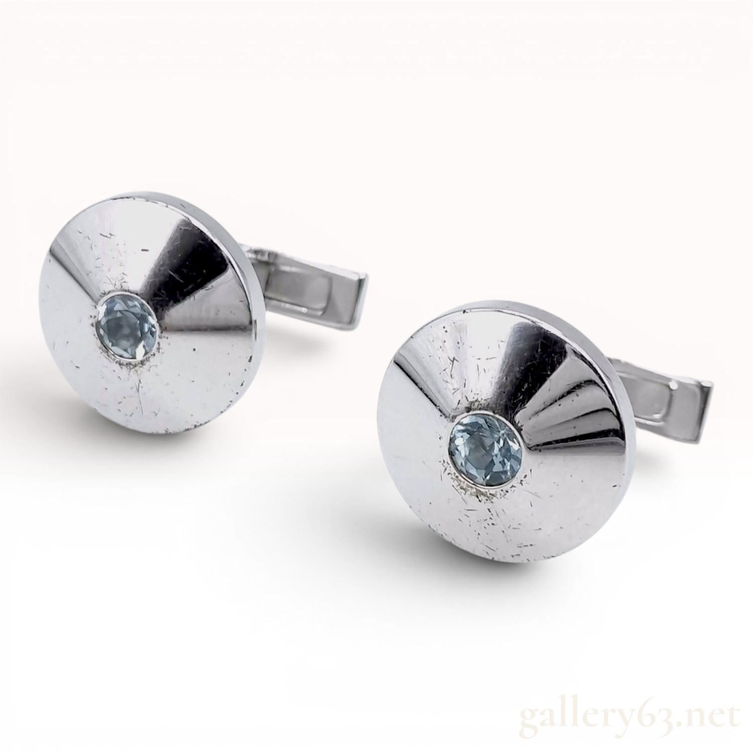 A Pair of Cartier Sterling Silver and Blue Topaz Round Cufflinks