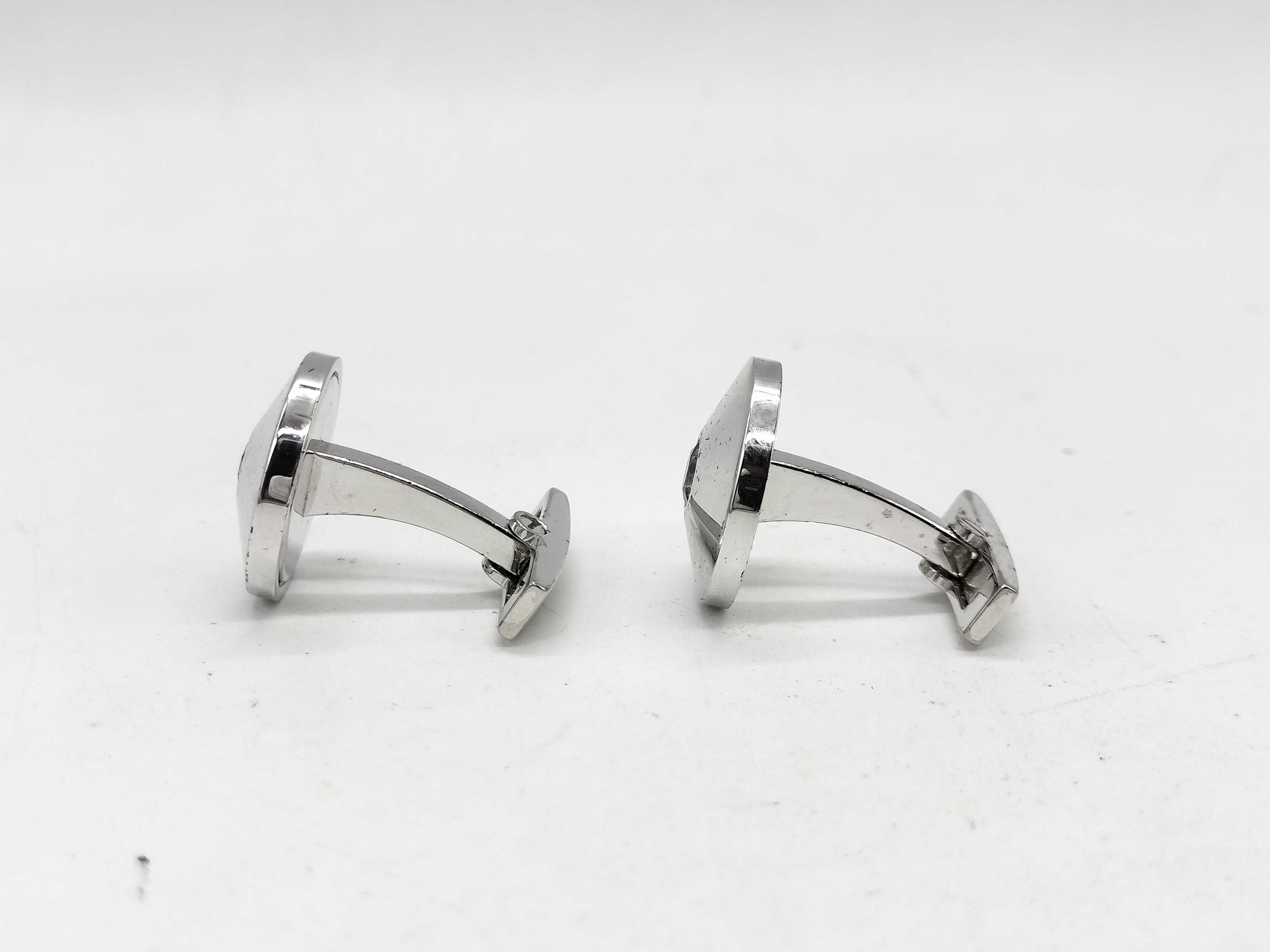 A Pair of Cartier Sterling Silver and Blue Topaz Round Cufflinks