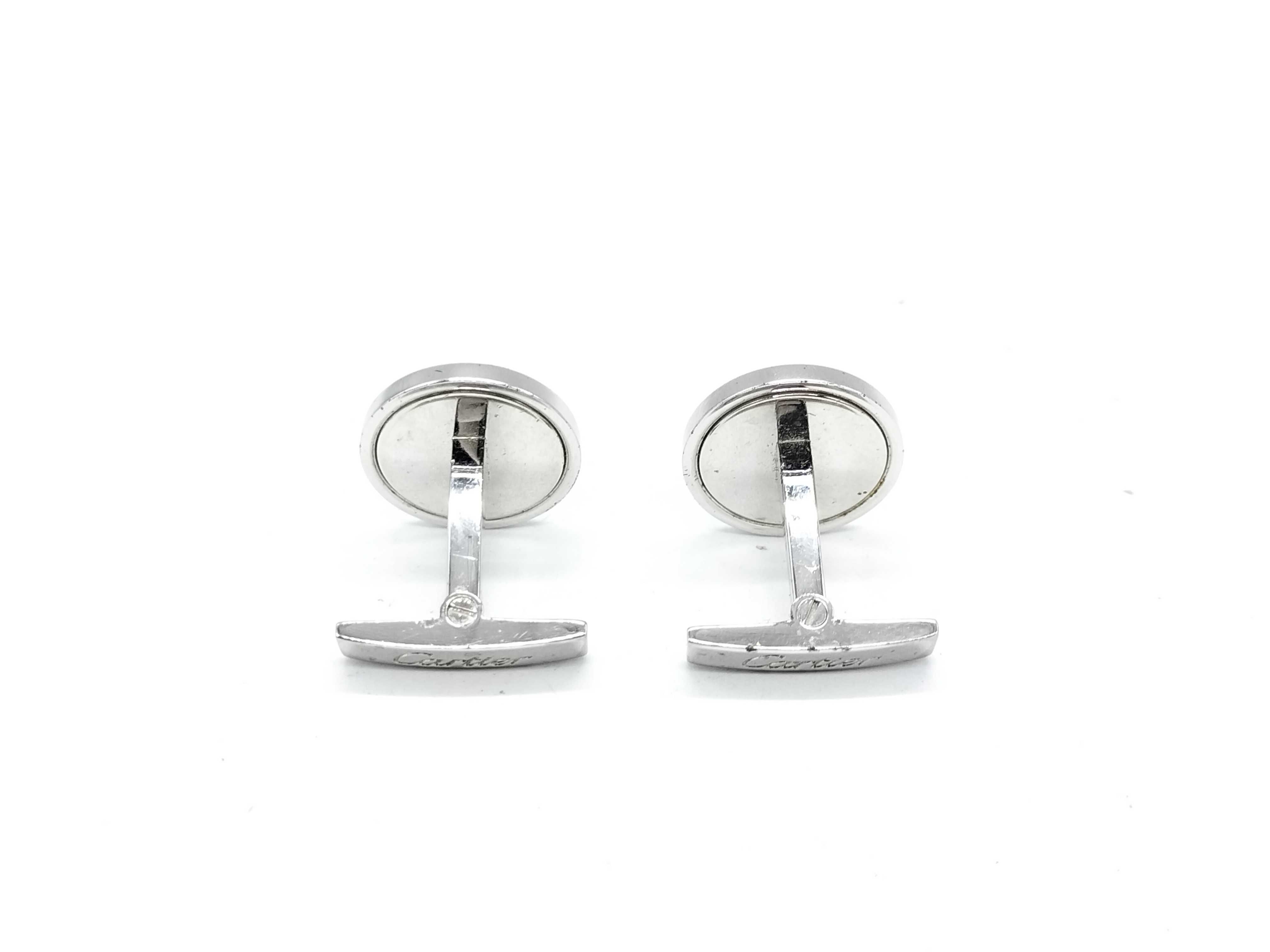 A Pair of Cartier Sterling Silver and Blue Topaz Round Cufflinks