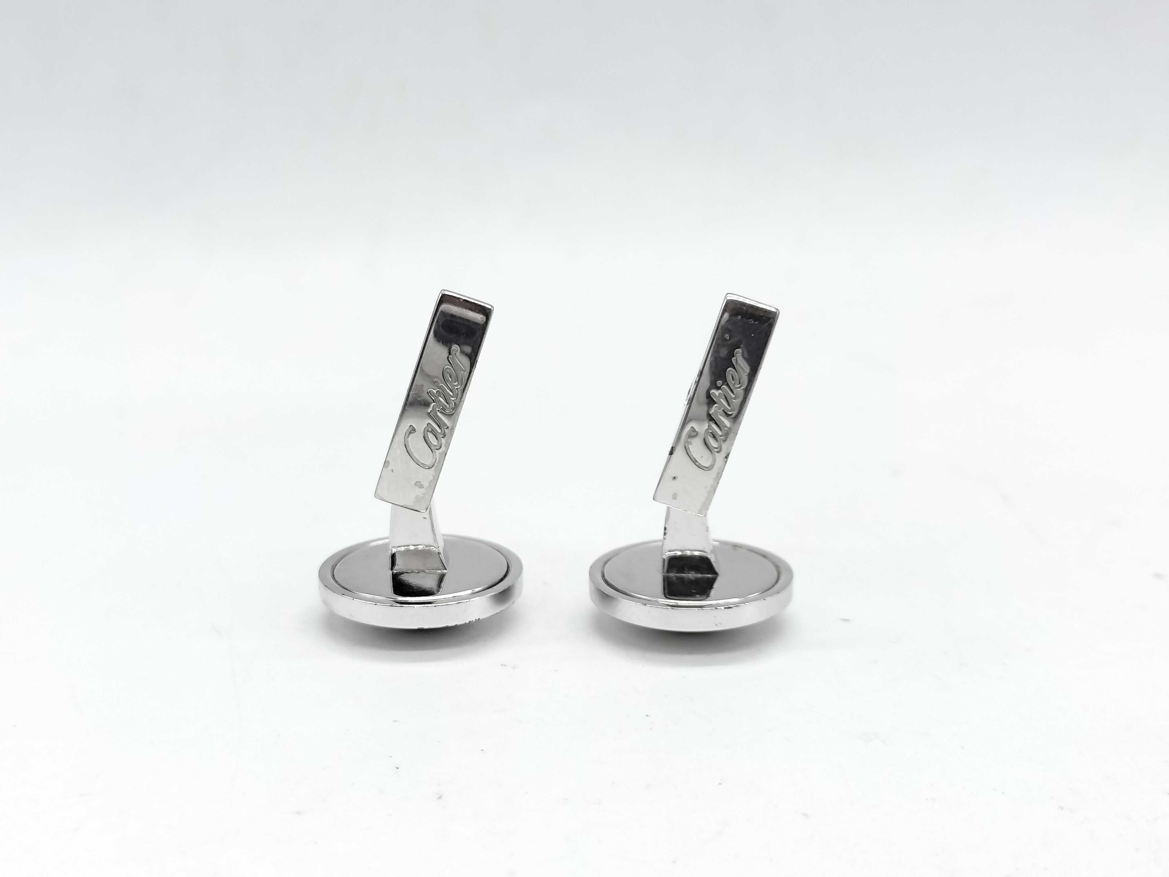 A Pair of Cartier Sterling Silver and Blue Topaz Round Cufflinks
