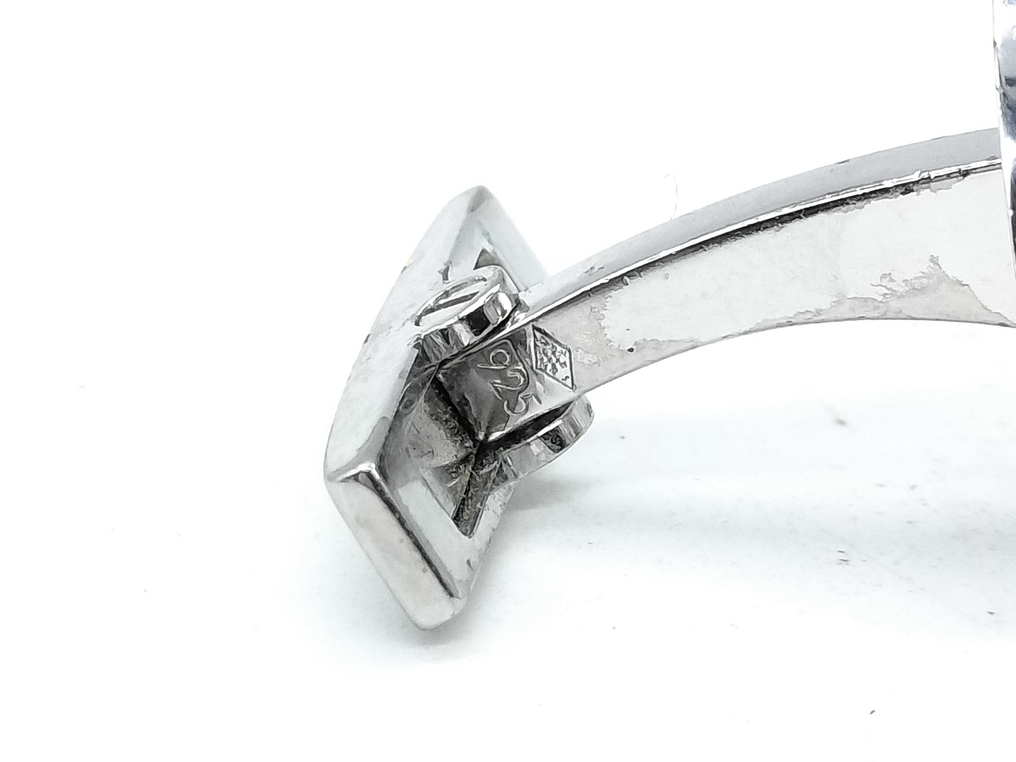 A Pair of Cartier Sterling Silver and Blue Topaz Round Cufflinks