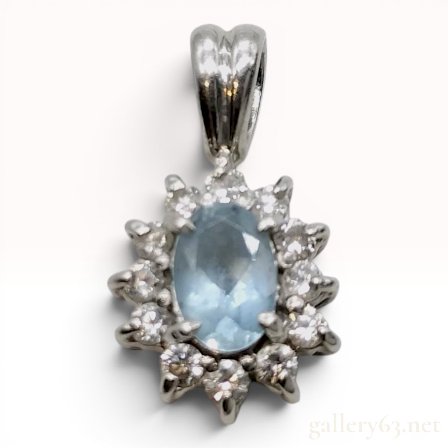 Platinum Oval Aquamarine and Diamond Halo Pendant