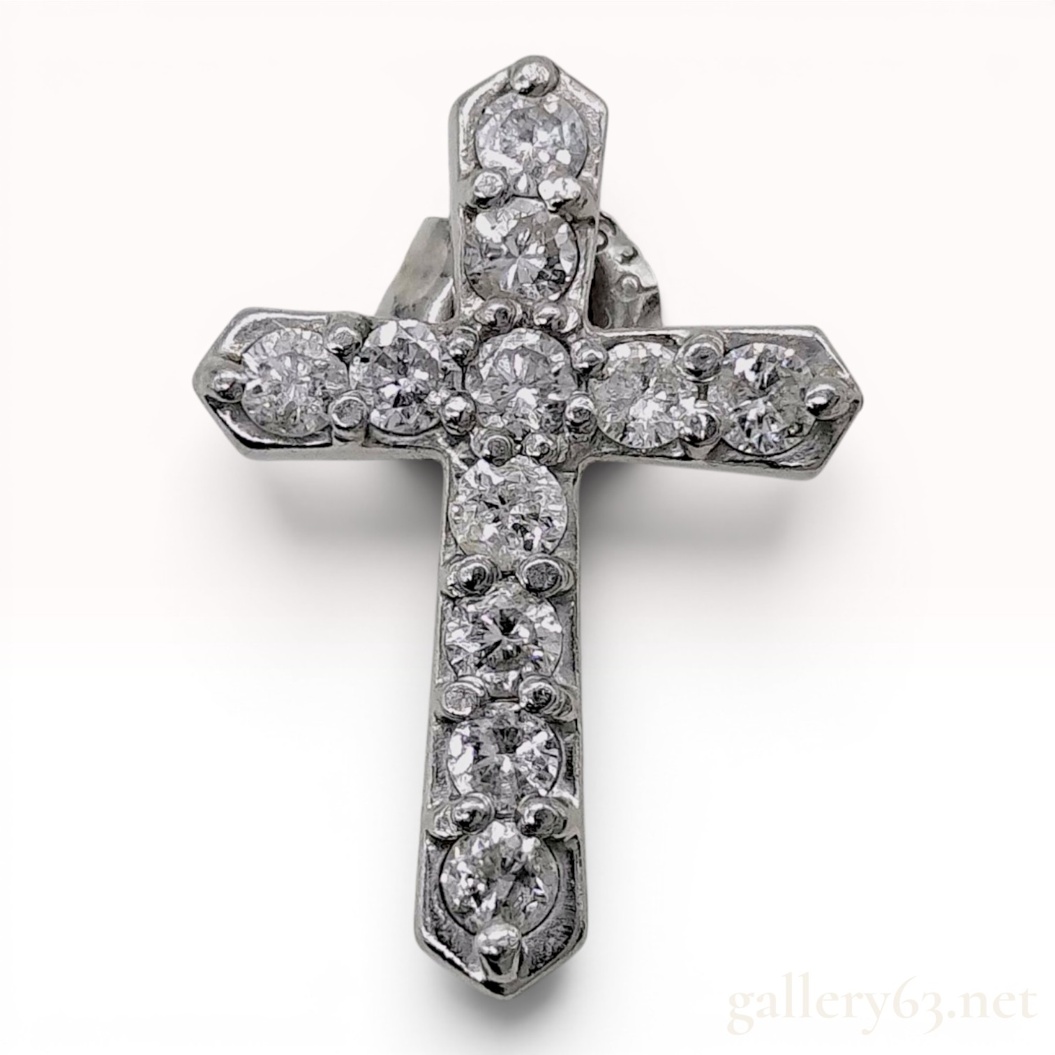 A Single Platinum and Diamond Cross Stud Earring