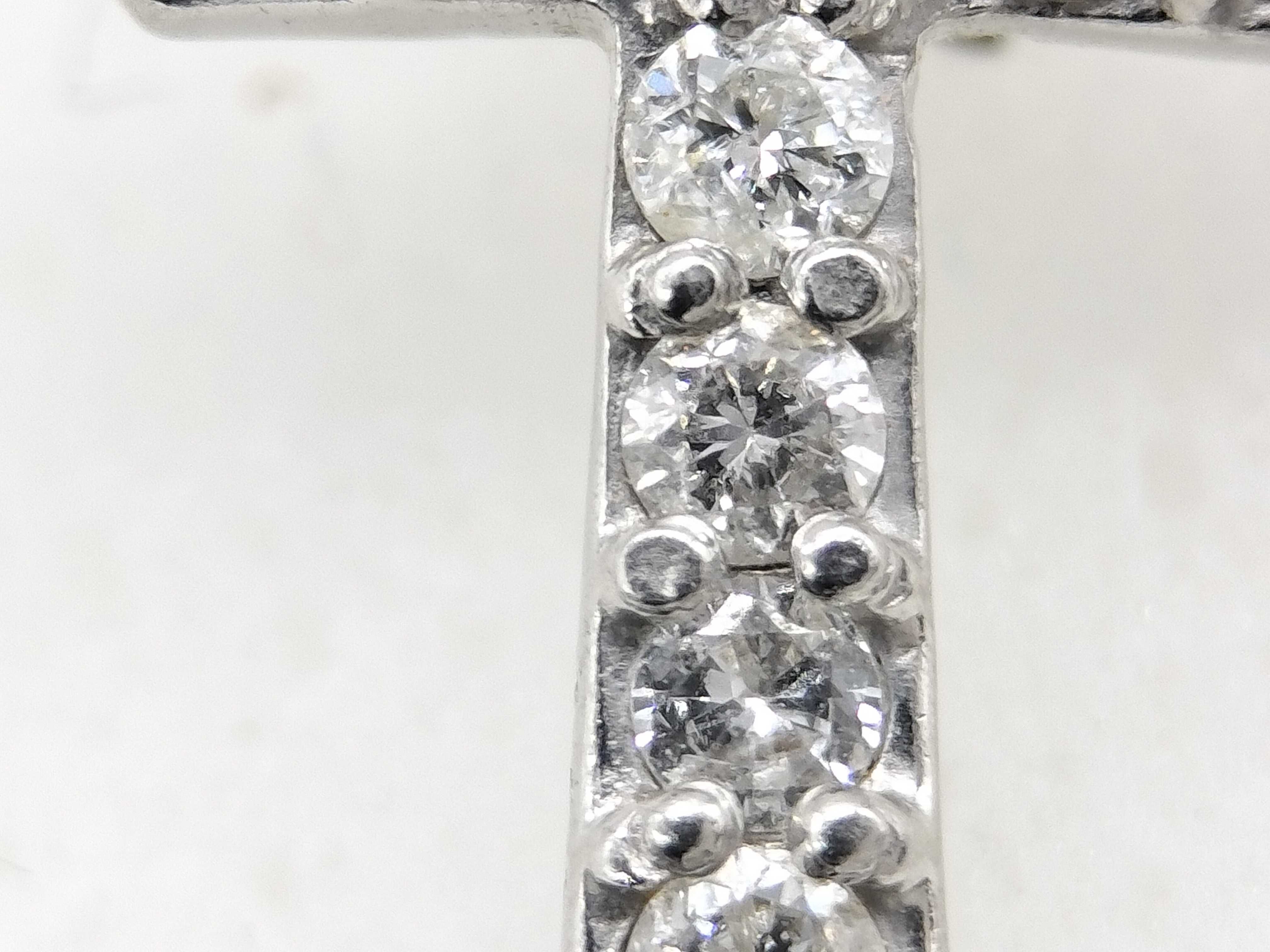A Single Platinum and Diamond Cross Stud Earring