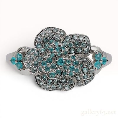 A Platinum and Paraiba Tourmaline Flower Cluster Ring. A platinum cocktail ring designed as a 