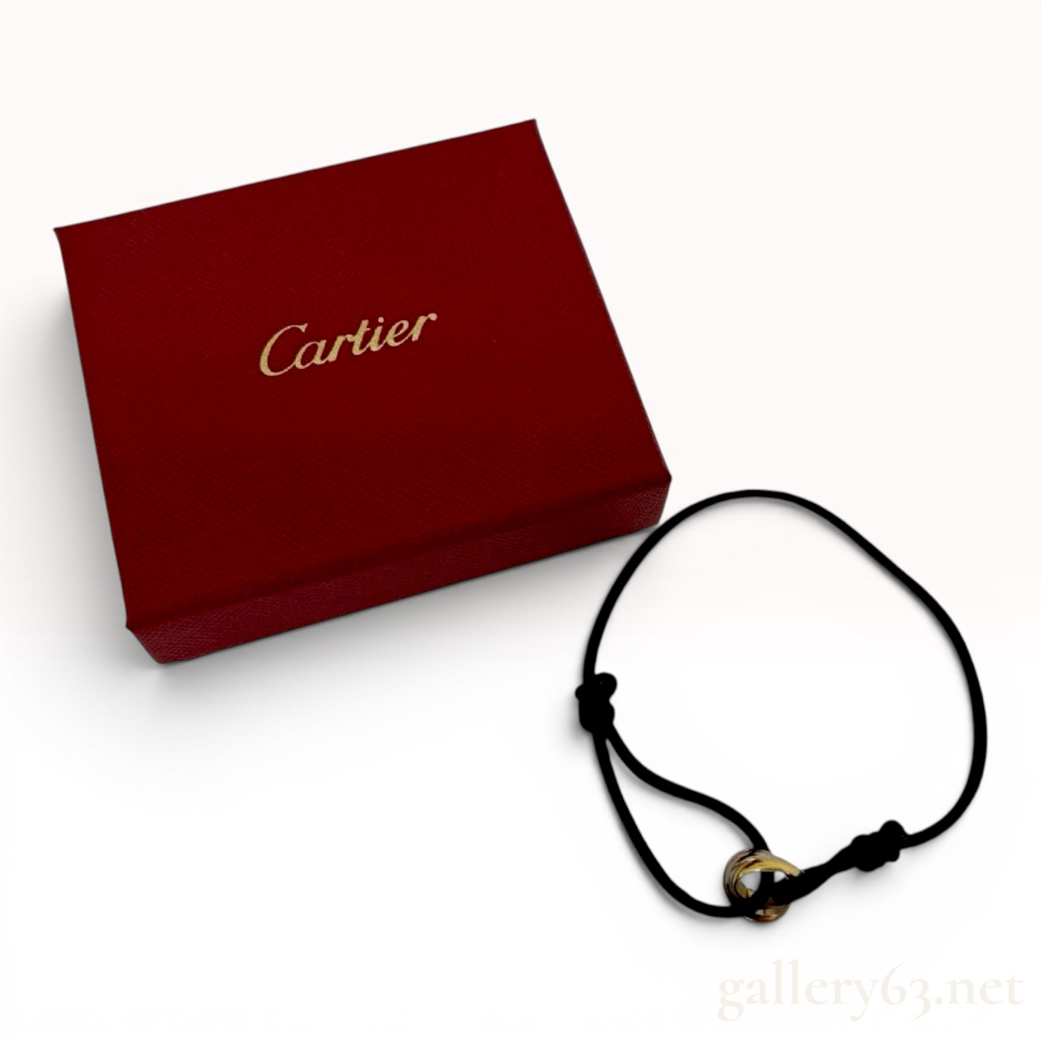 A Cartier Tri-Color 18 Karat Gold Trinity Cord Bracelet