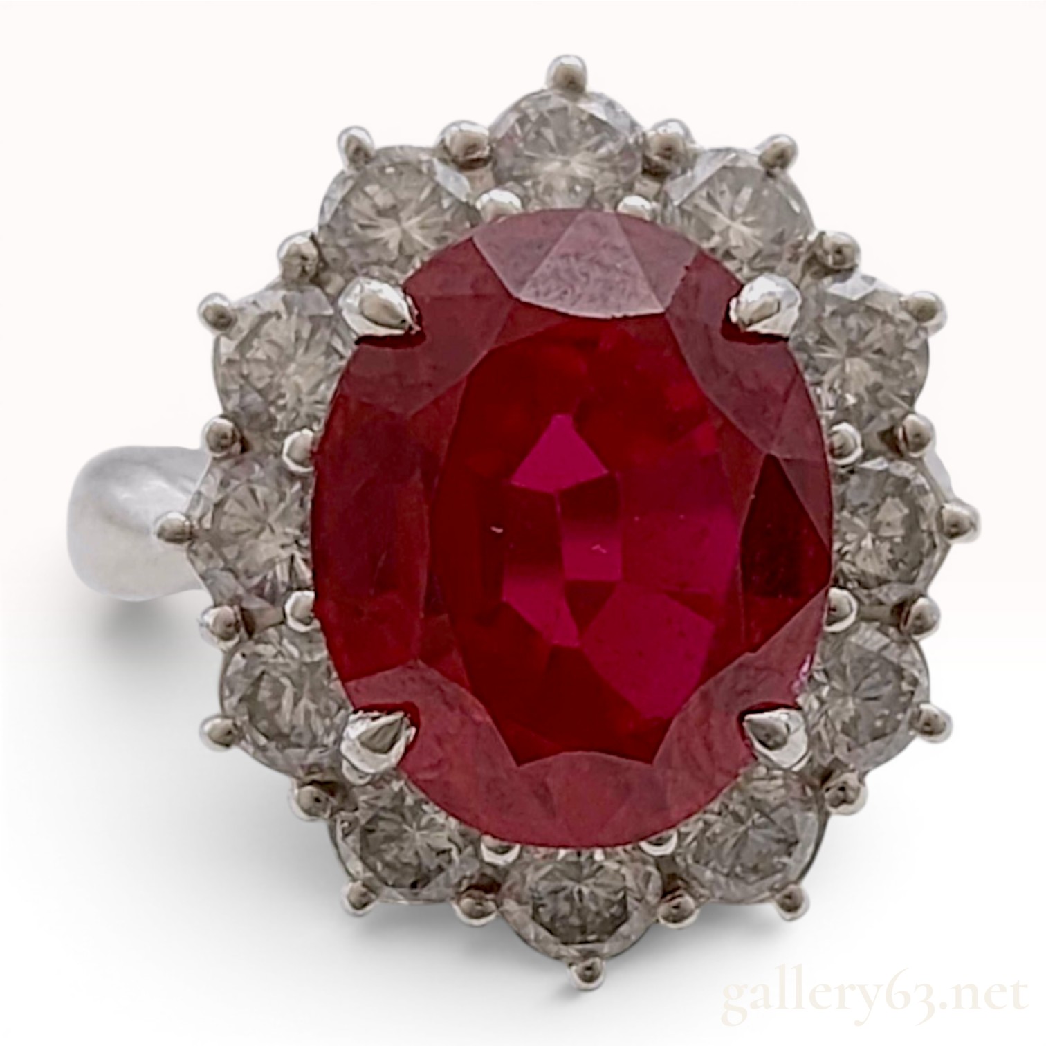 A 5.30ct Ruby and 1.04ctw Diamond Halo Ring in Platinum