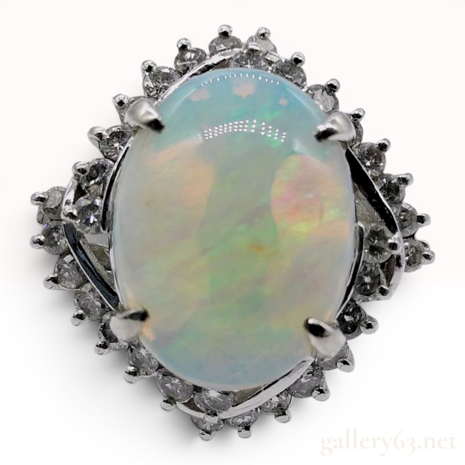 A 2.41ct Australian Opal and .50ctw Diamond Halo Cocktail Ring in Platinum