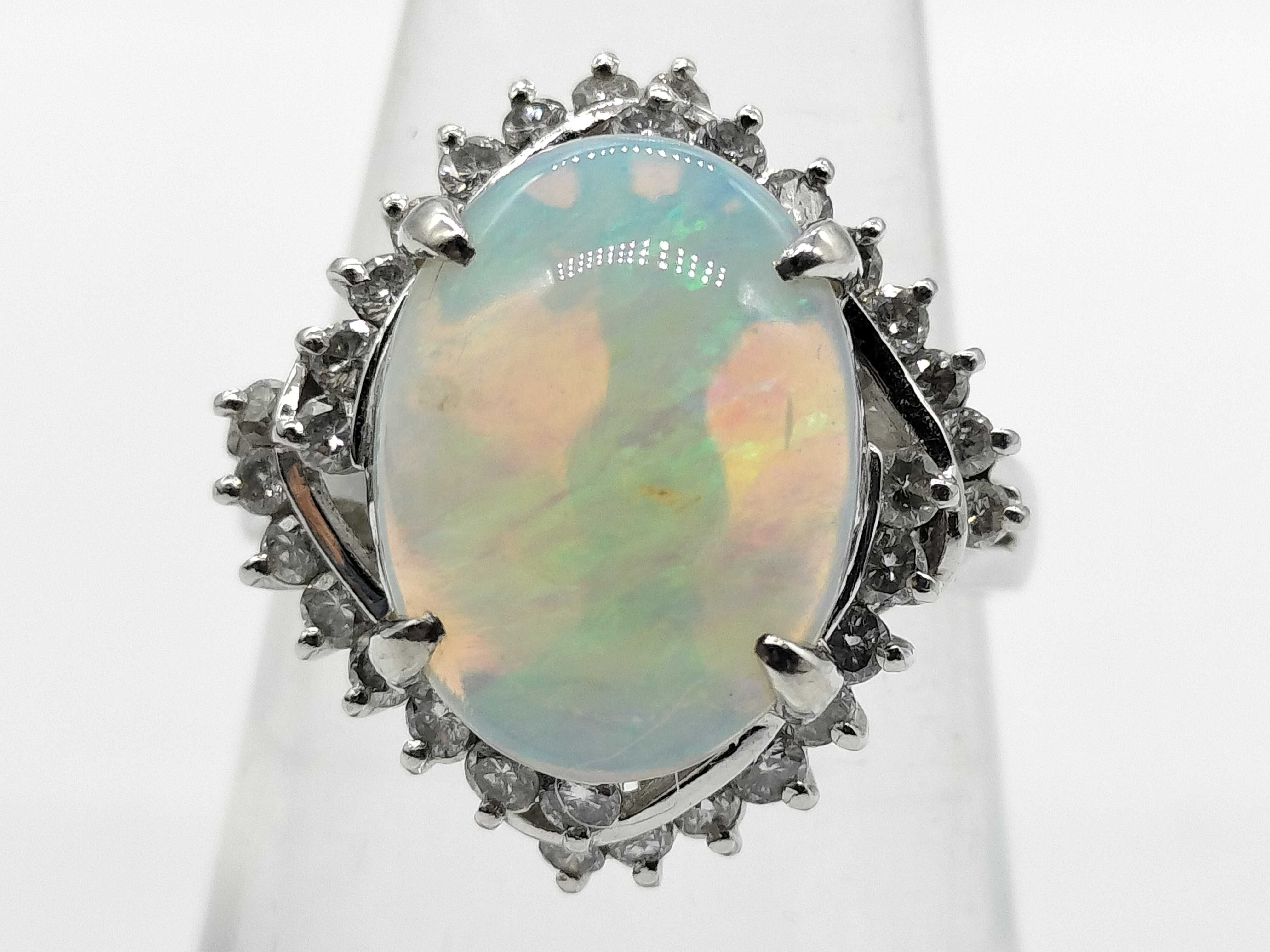 A 2.41ct Australian Opal and .50ctw Diamond Halo Cocktail Ring in Platinum